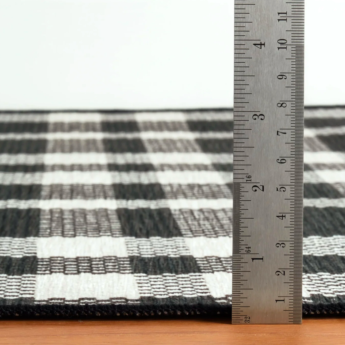 Thickness of Pine Cone Hill Houston Plaid Machine Washable Rug in Black