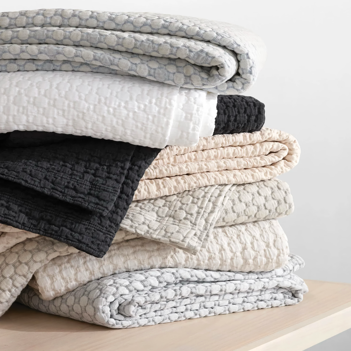 Stack of Pine Cone Hill Lodi Matelasse Coverlets in All Colors