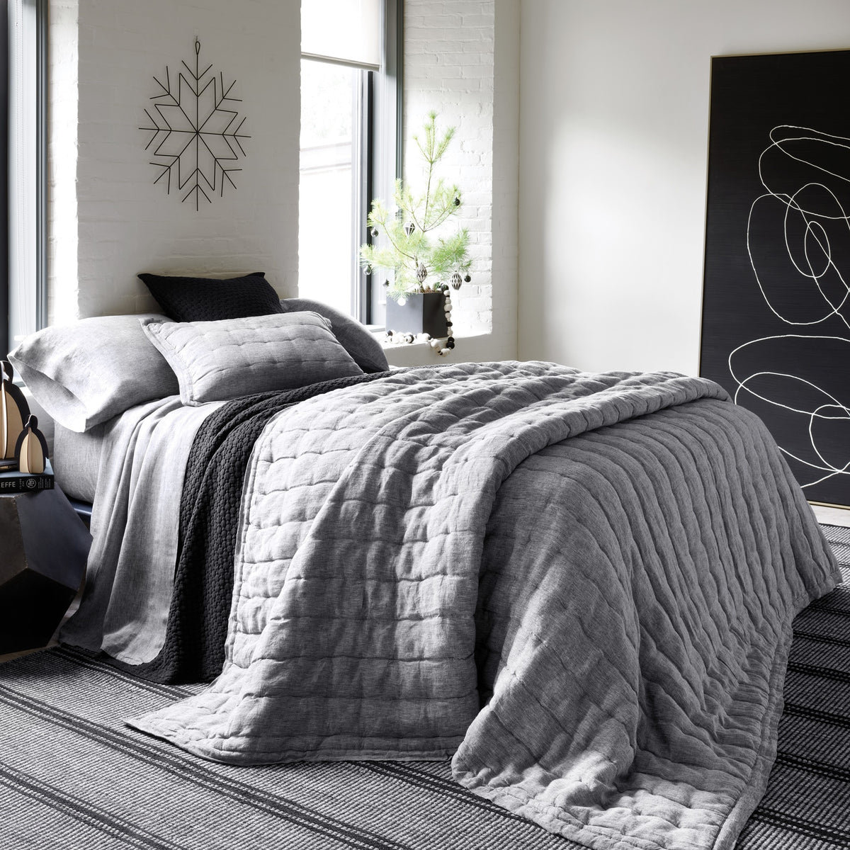 Lifestyle Shot of Pine Cone Hill Lush Linen Puff in Color Black