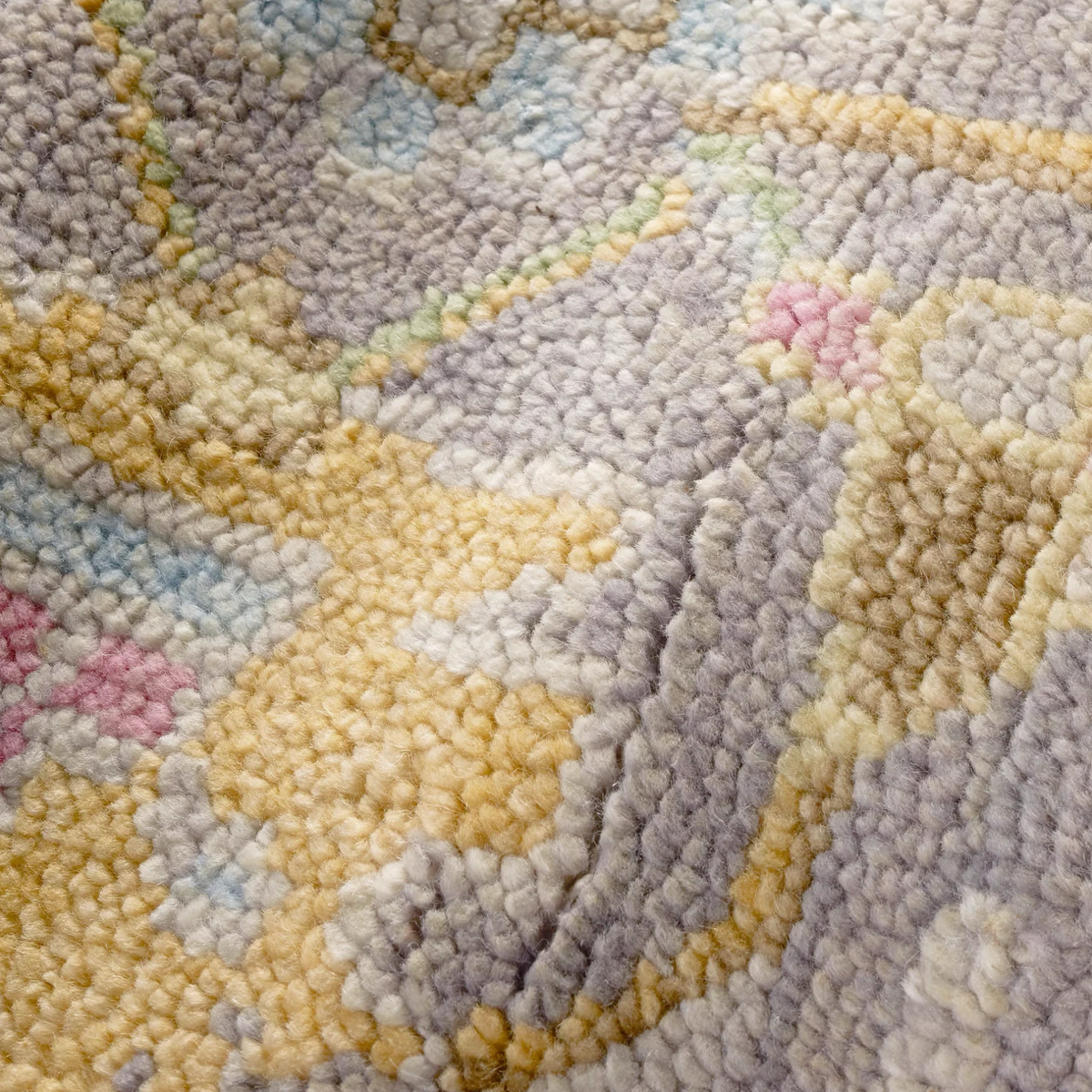 Closeup of Pine Cone Hill Masterpiece Rug Collection in Iris Design