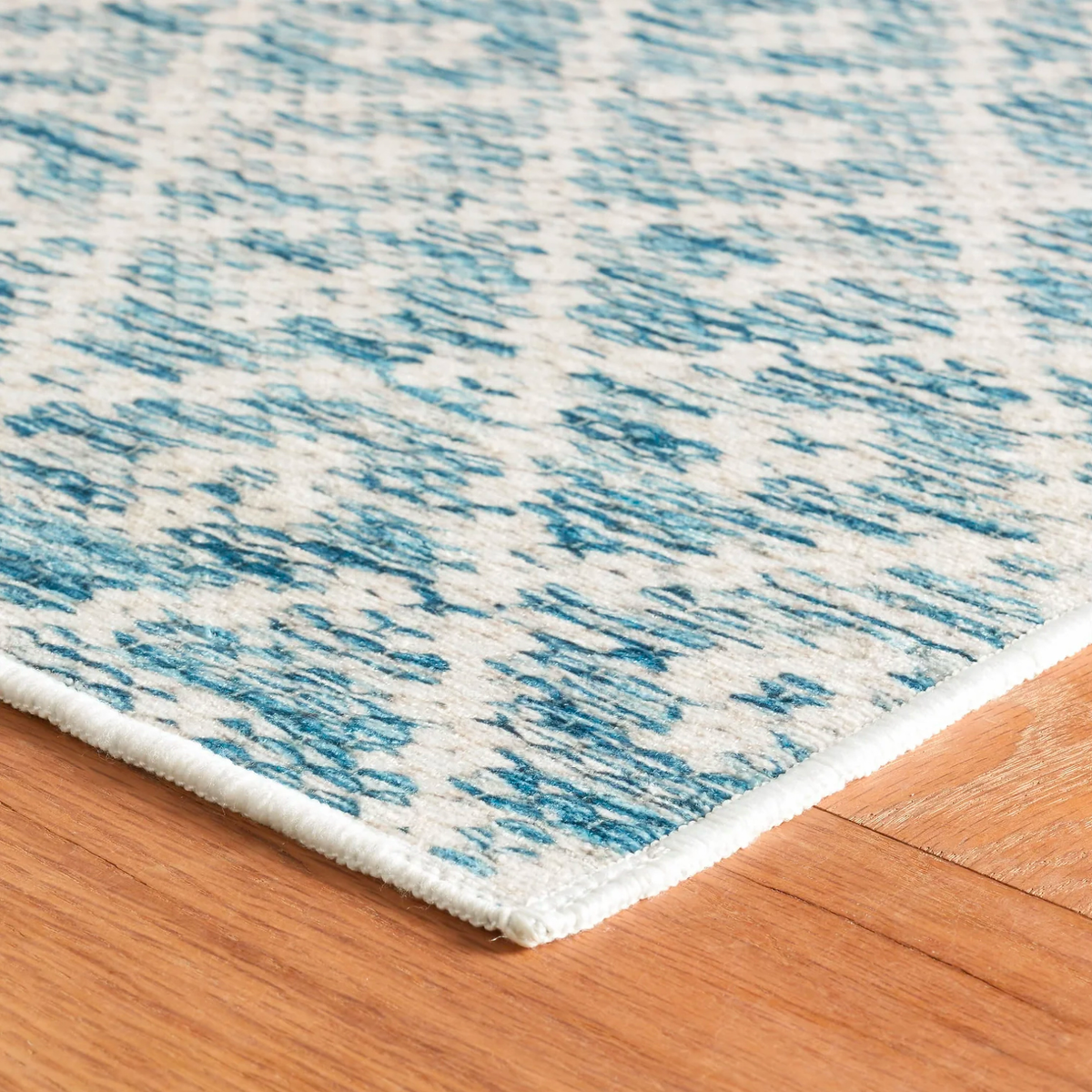 Corner View of Blue Pine Cone Hill Melange Diamond Machine Washable Rug