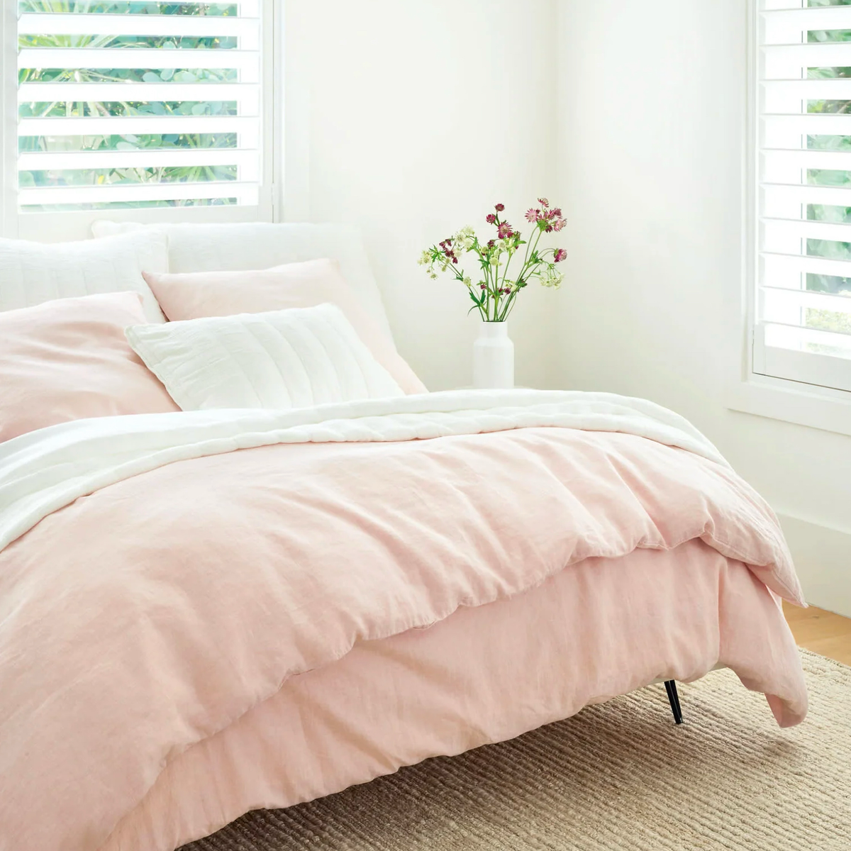 Corner View of Pine Cone Hill Monet Quilted Coverlet and Shams with Pink Coordinate Bedding