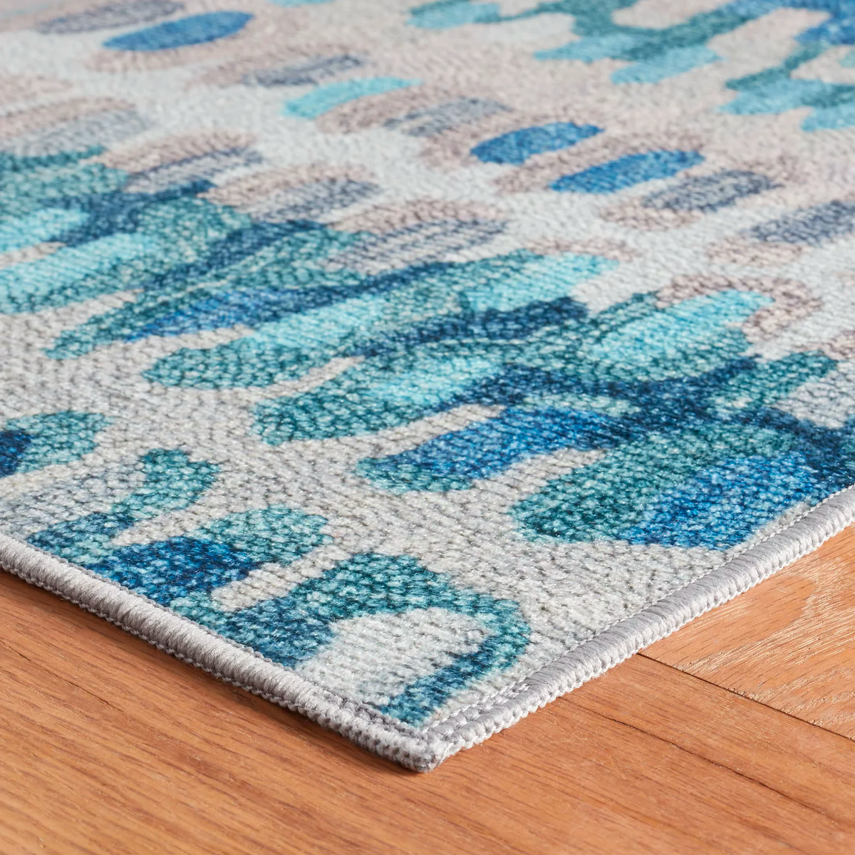 Corner of Pine Cone Hill Paint Chip Machine Washable Rug in Blue