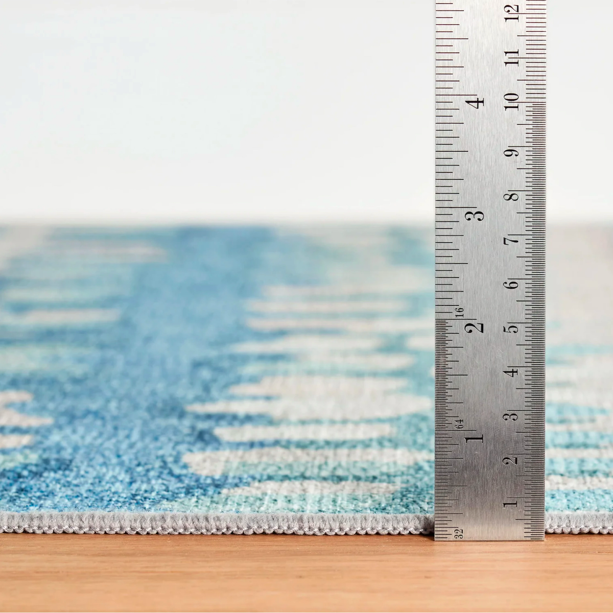 Thickness of Pine Cone Hill Paint Chip Machine Washable Rug in Blue