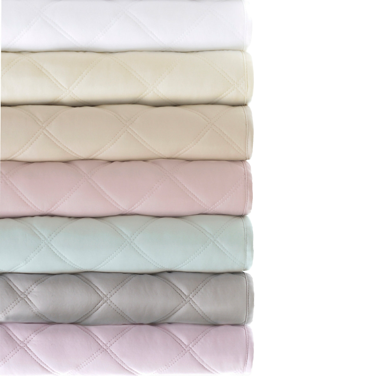 Stack of Pine Cone Hill Quilted Silken Solid Coverlets in All Colors