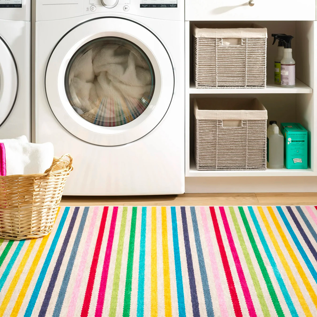 Pine Cone Hill Rainbow Stripe Machine Washable Rug in a laundry room