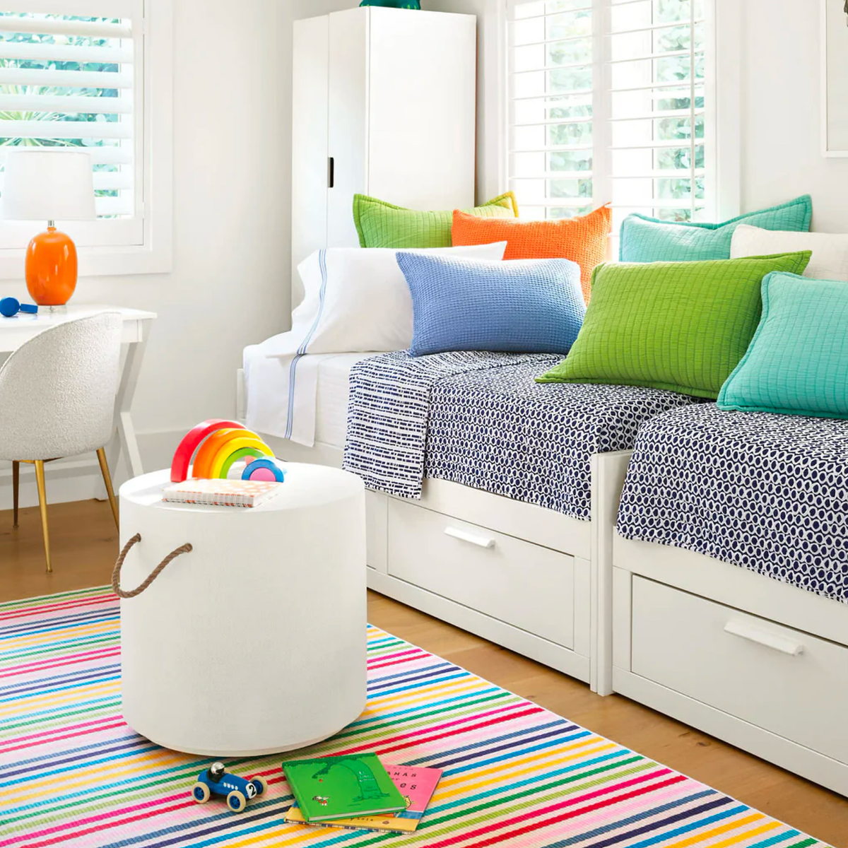 Pine Cone Hill Rainbow Stripe Machine Washable Rug in a play room