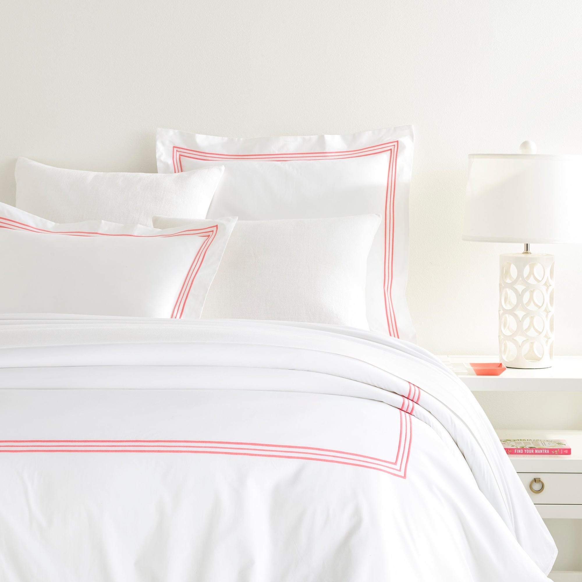 Duvet Cover of Pine Cone Hill Trio in Bed with Shams in Color Coral
