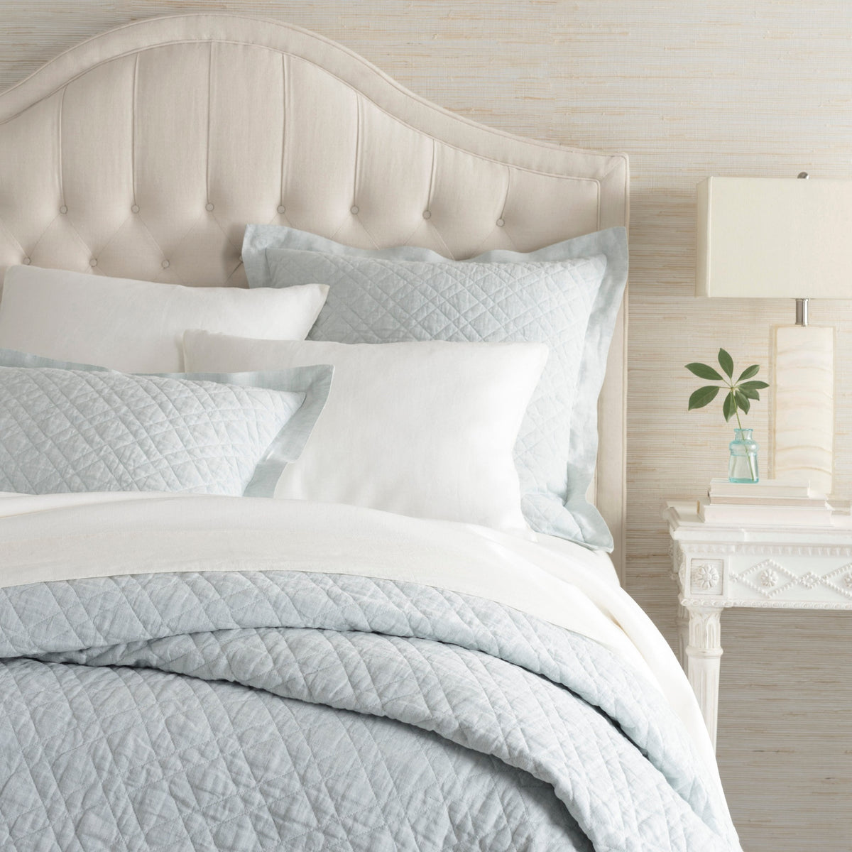 Corner Shot of Pine Cone Hill Washed Linen Quilted Bedding in Color Sky
