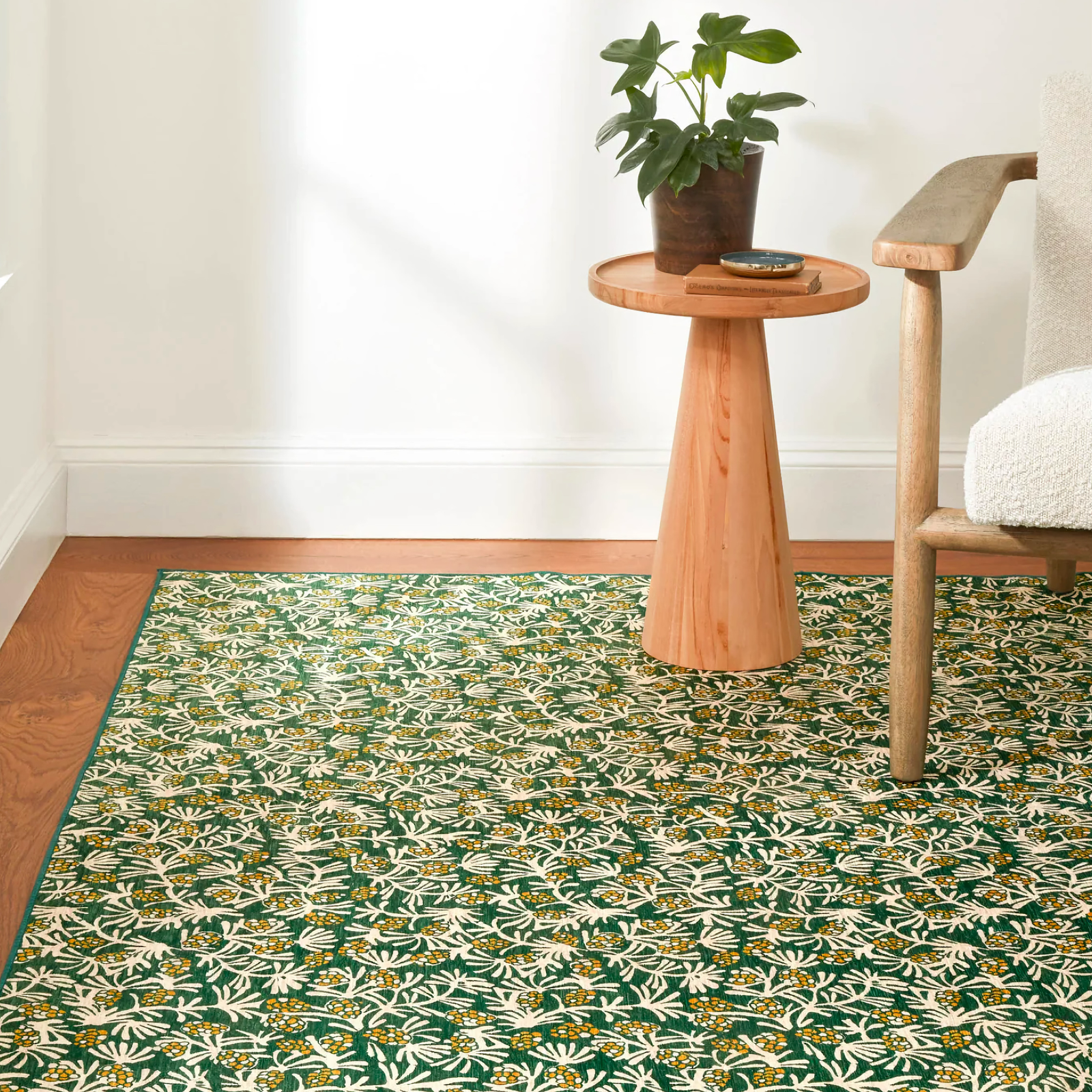 Lifestyle of Pine Cone Hill Winter Pinecones Machine Washable Rug in Green Color on the Floor