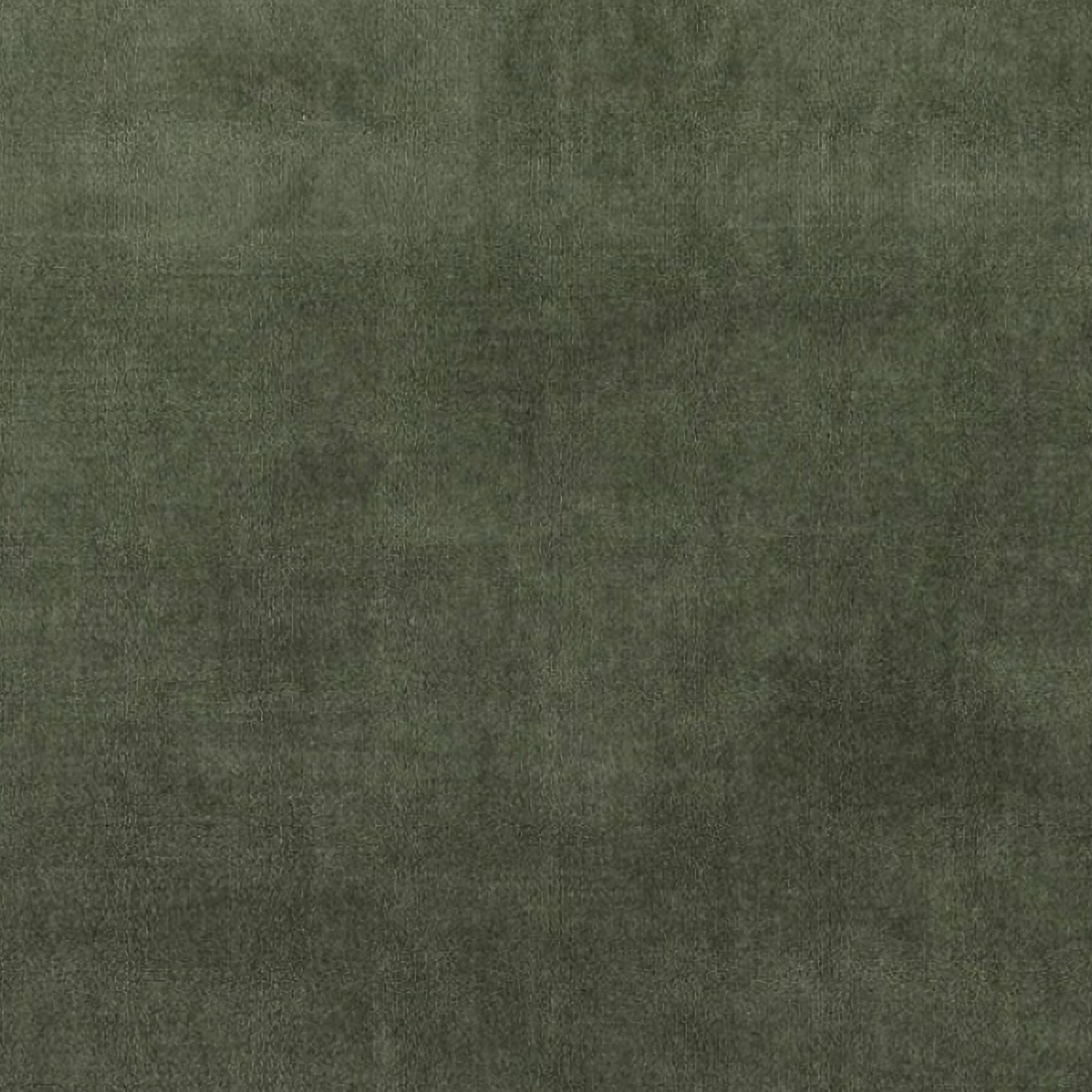 Pine Cone Hill Marie Flanagan Gehry Velvet/Linen Decorative Pillow in Sage near a fireplace