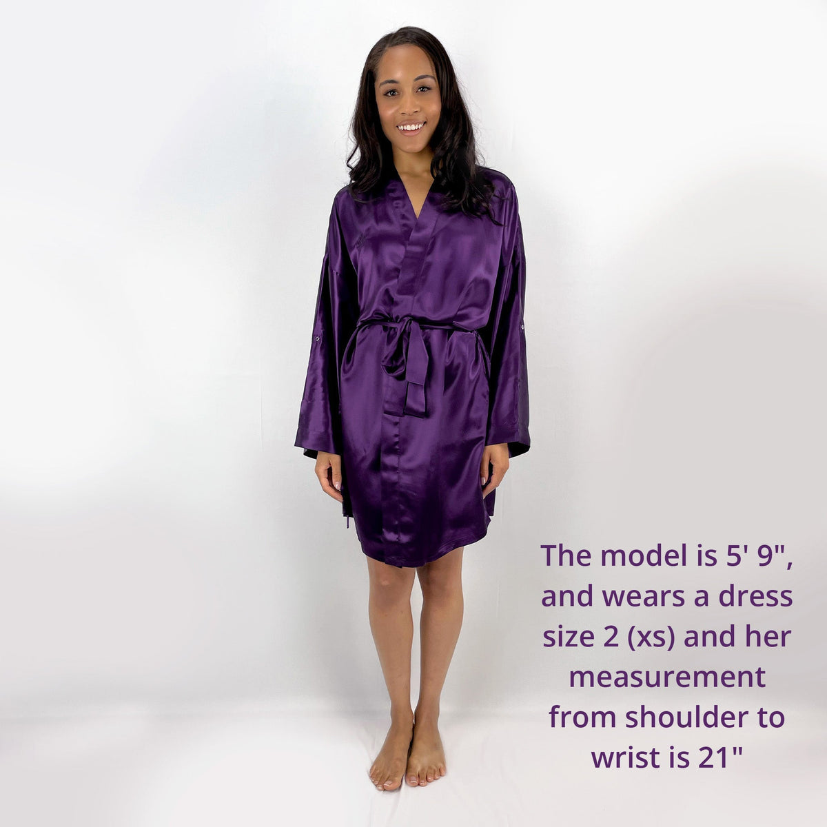 Woman standing in a front view, with measurements and size details of a luxury robes for women