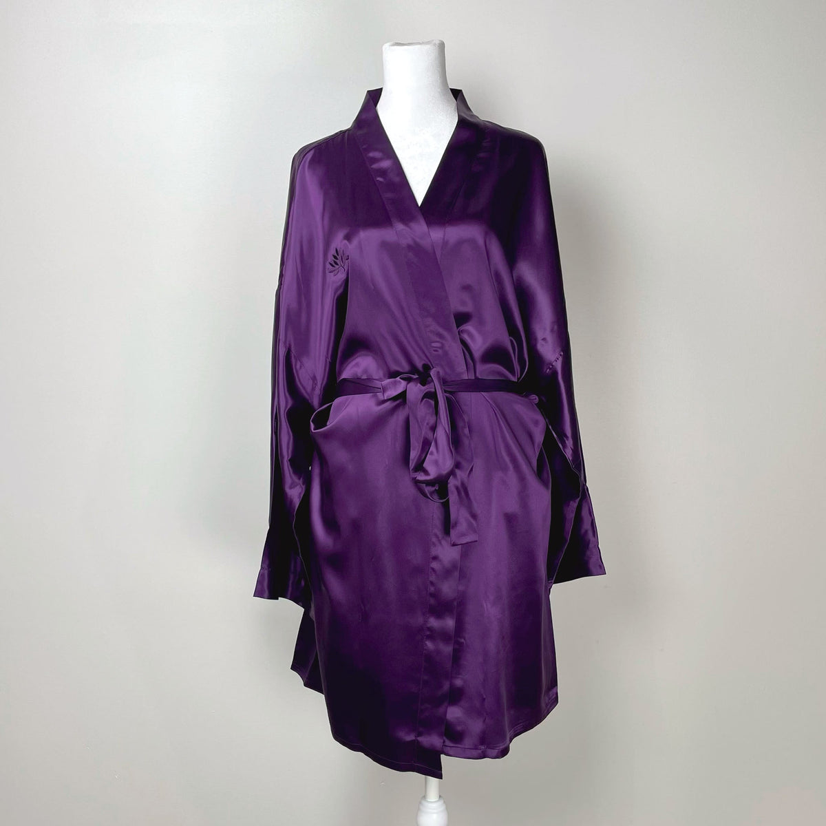Womens silk kimono robe displayed on a mannequin, showcasing its elegant design and flow