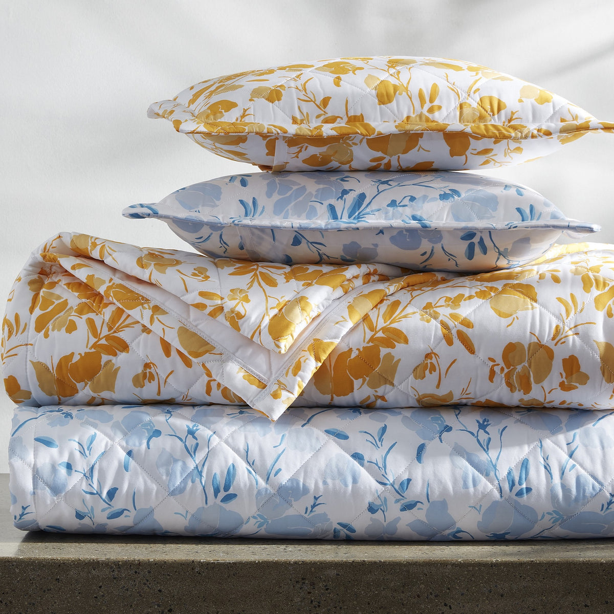 Stack Image of Quilted Matouk Alexandra Bedding in Goldenrod with Sky Color