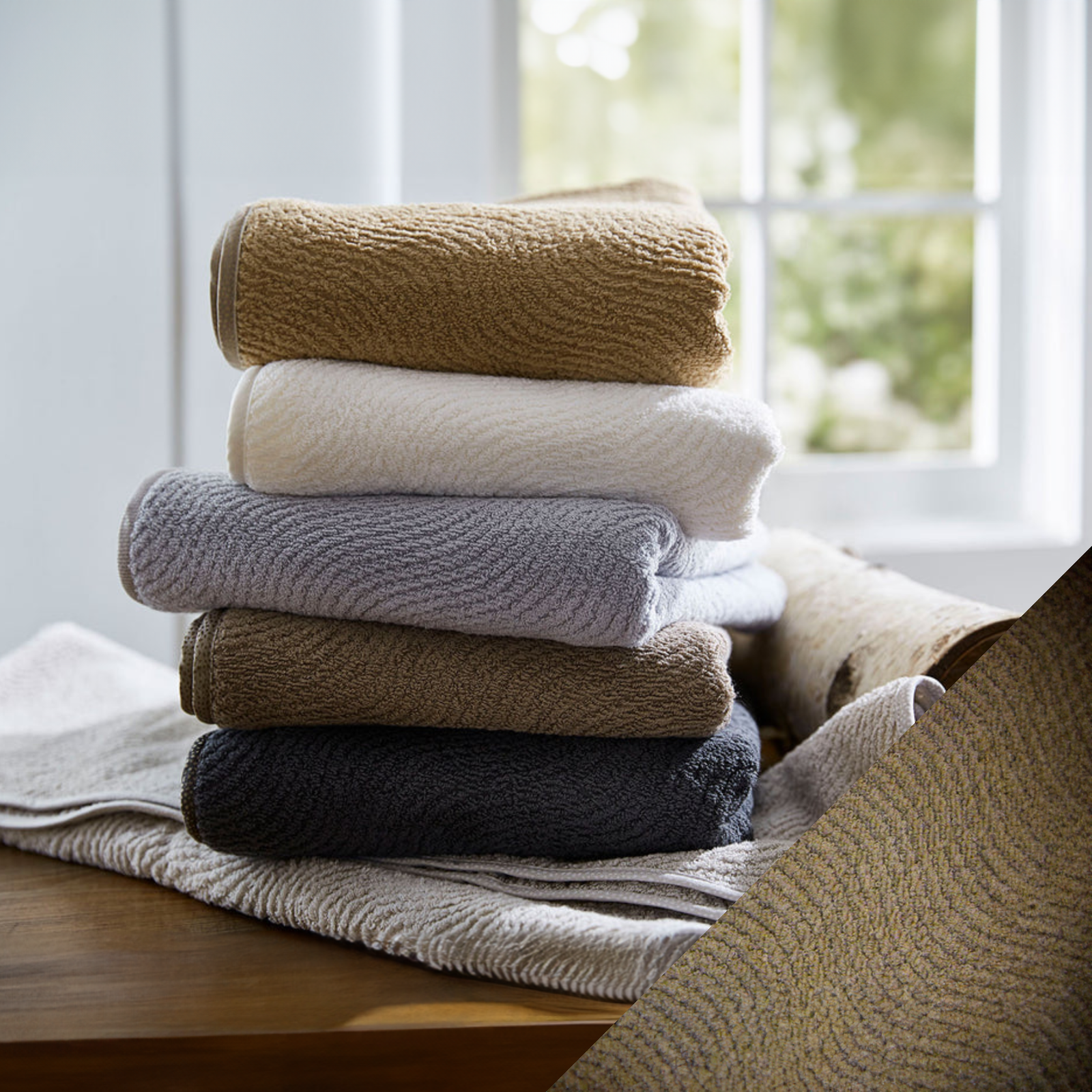 Stack of SDH Big Sur Bath Towels and Mats with Taupe Swatch