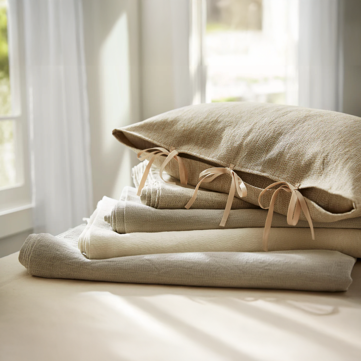 Stack of SDH Camden Bedding - from top to bottom: Tan, Rye, Stucco, Dove