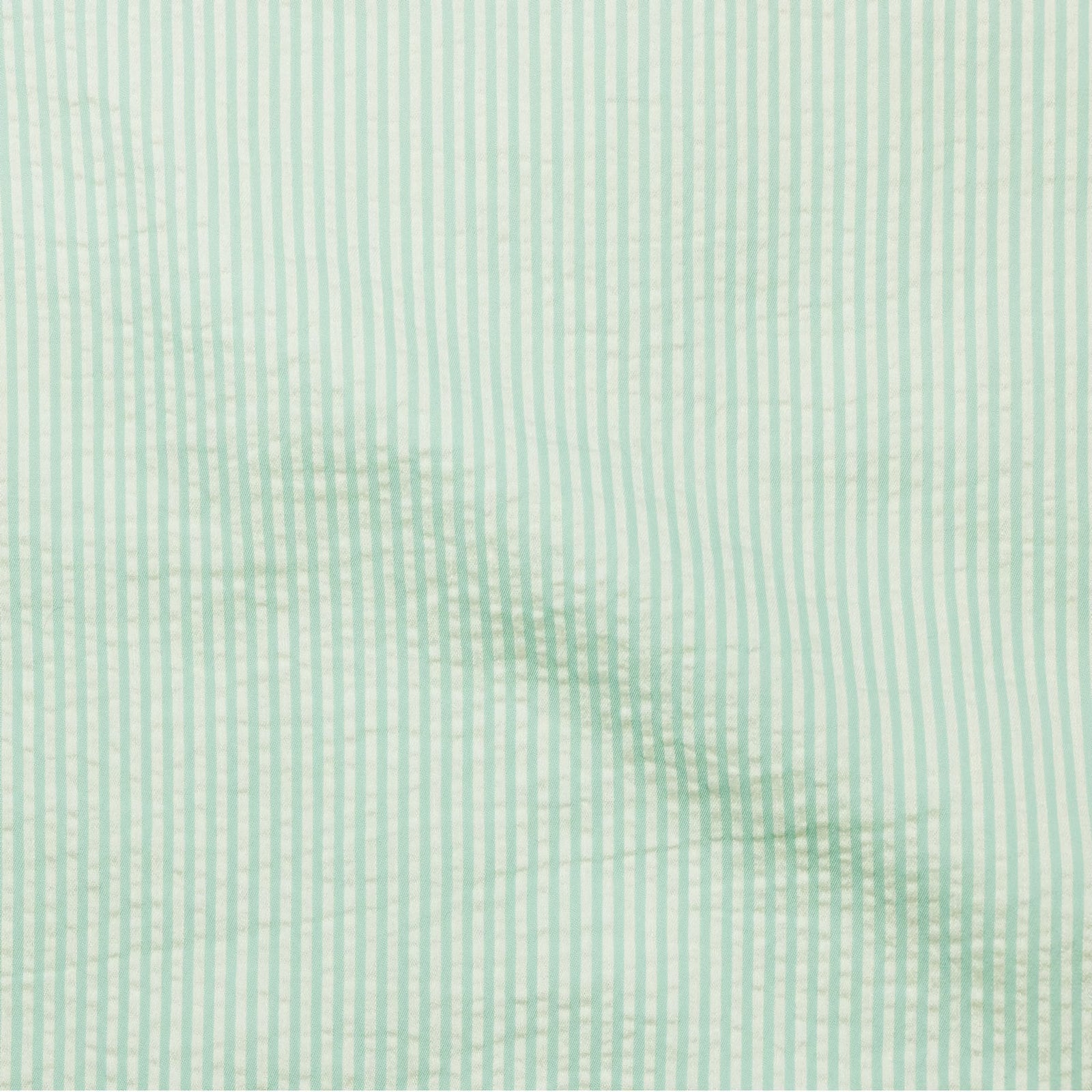 Stack of SDH Elba Bedding Shams with Aruba Swatch