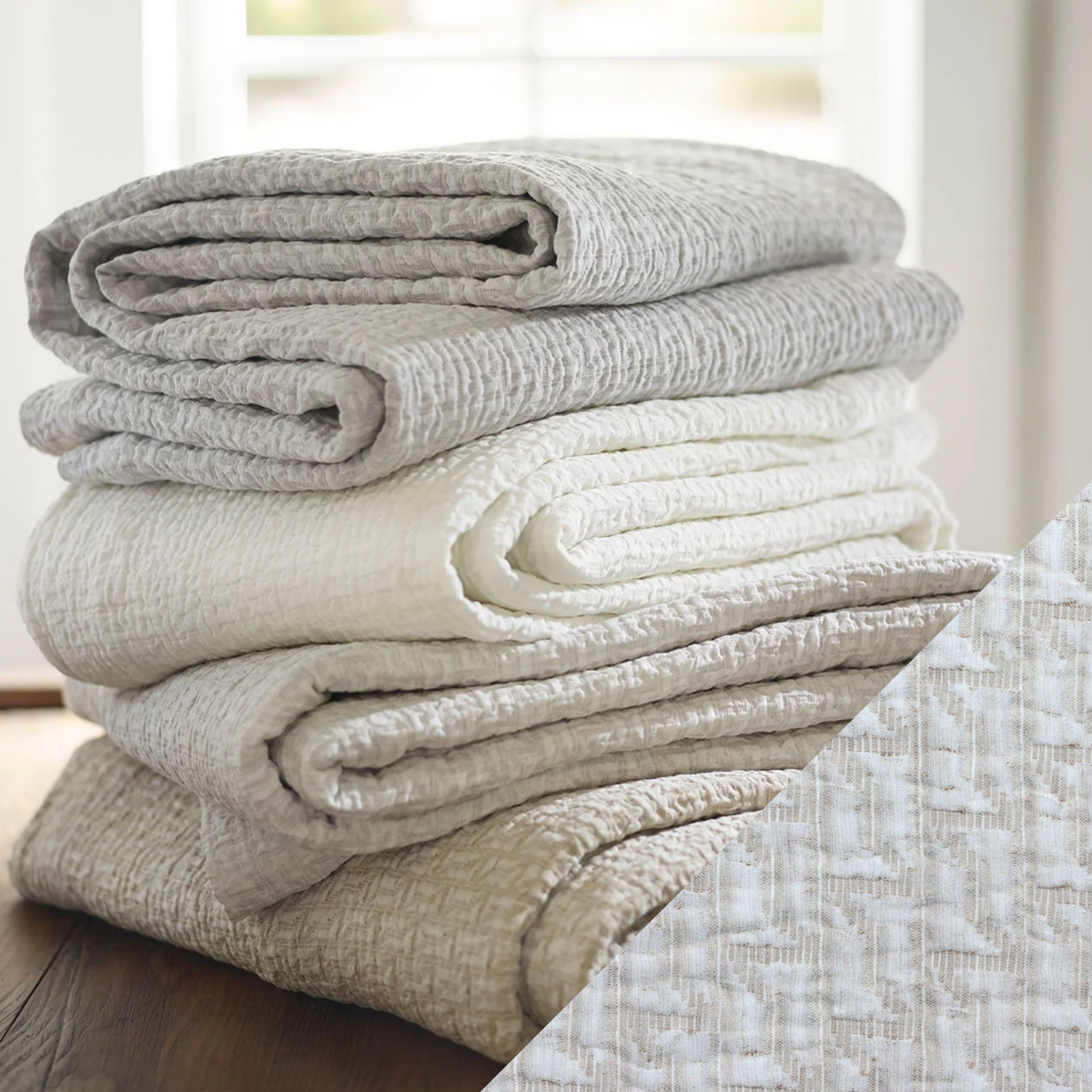 Stack of folded SDH Eton Bedding with Slate Swatch