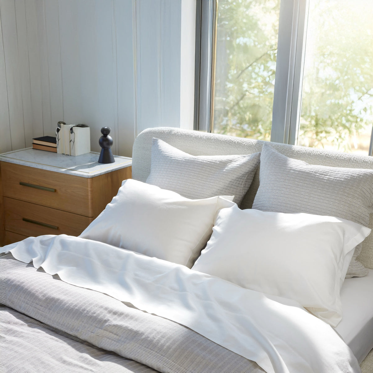 Kenji Driftwood duvet, Koji Driftwood european decorative pillows, Patina Snow sheeting and standard pillows. 