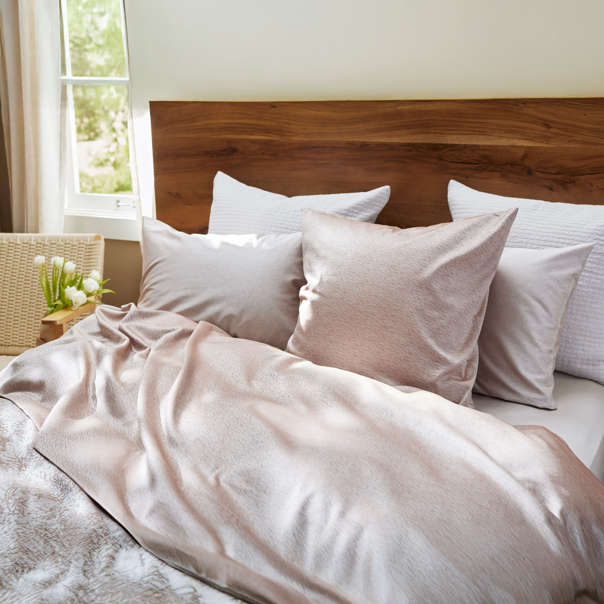 Midori Rust top sheet & european pillow, Gobi Rust standard pillows, Piani Latte european decorative pillows, Livenza Rust duvet cover, & Julia Rust fitted sheet.