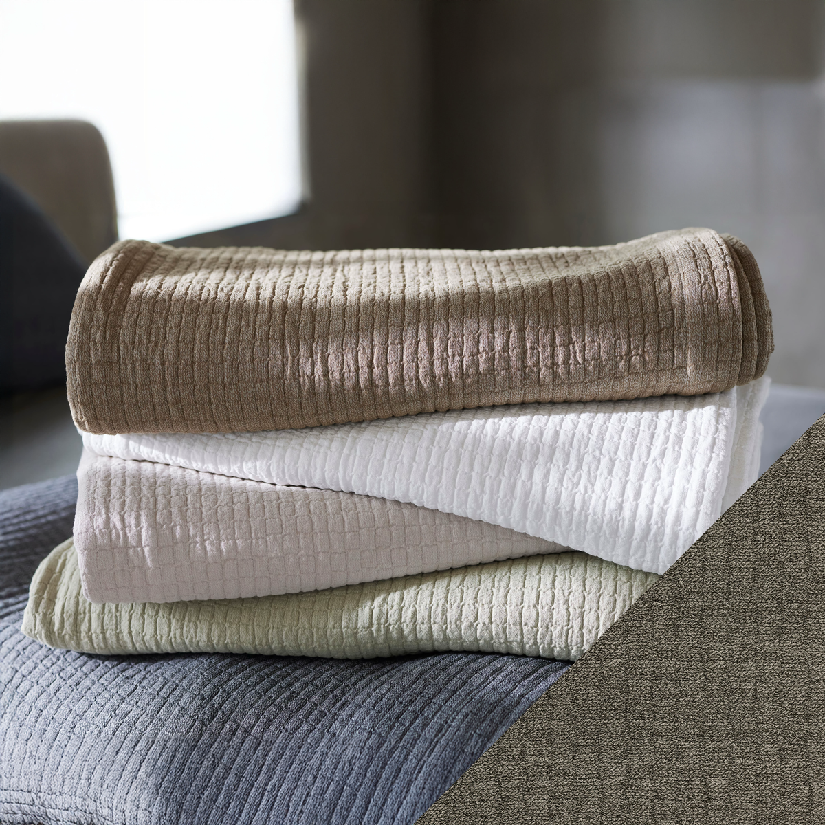 Stack of SDH Piani Bedding with Flint Swatch