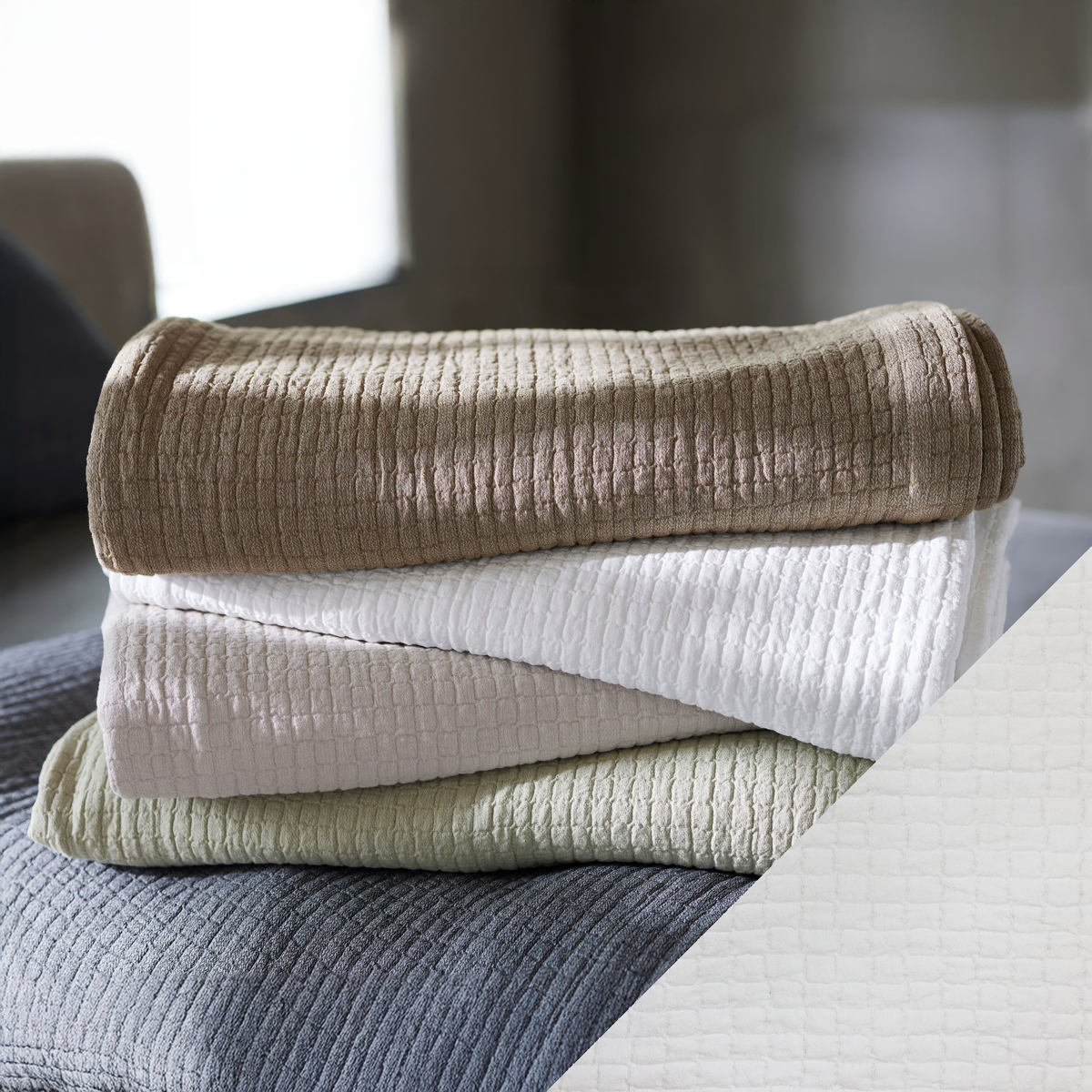 Stack of SDH Piani Bedding with Stucco Swatch