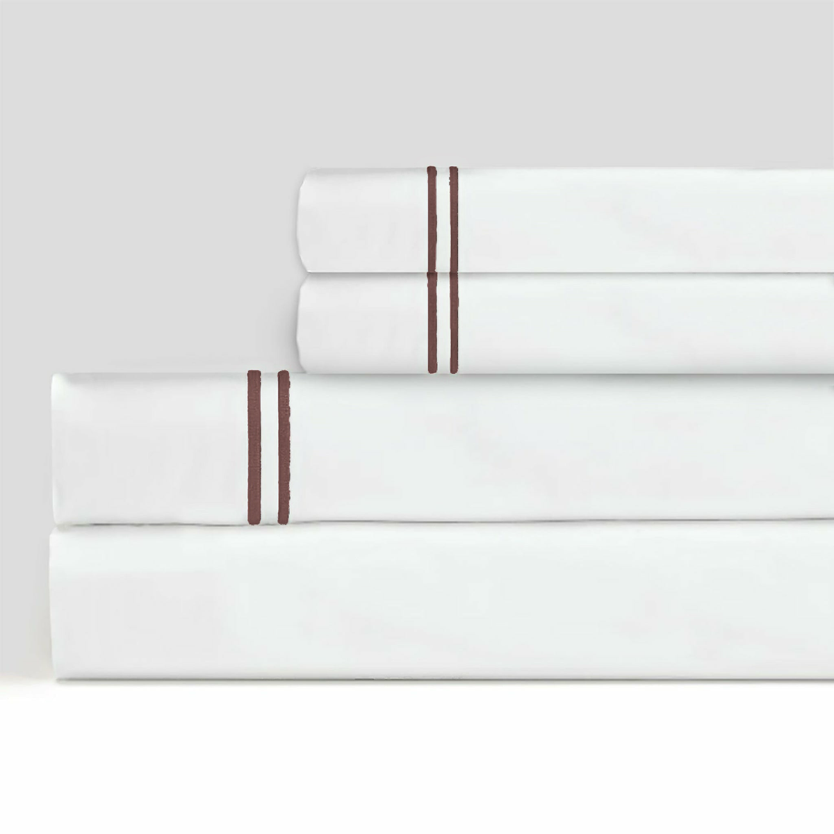 Stack of Sferra Grande Hotel Sheet Sets White and Mocha