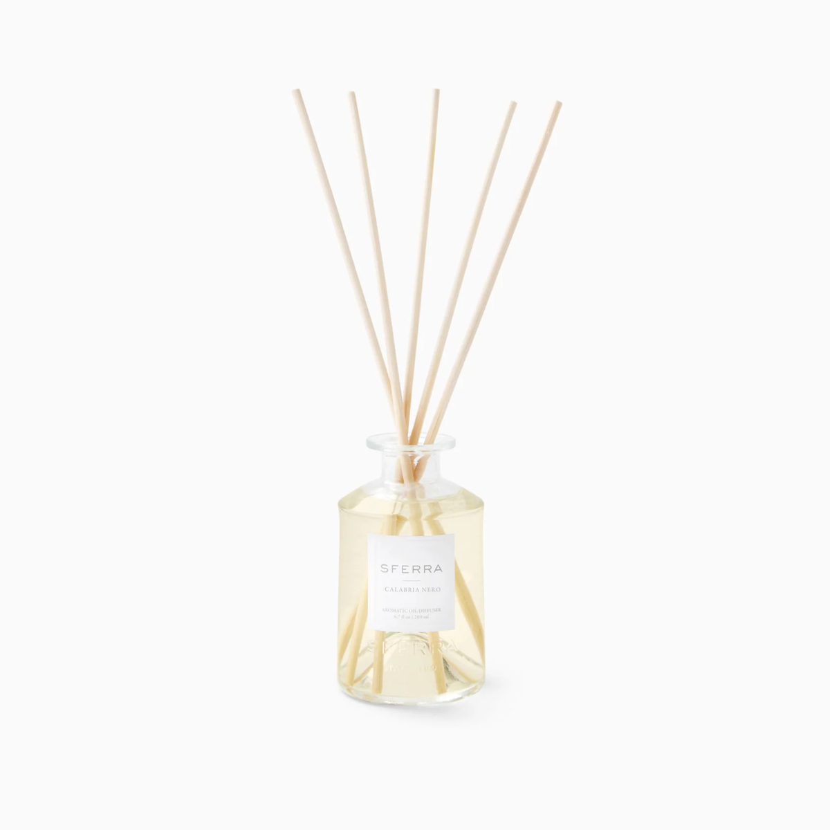 Clear glass reed diffuser with SFERRA Calabria Nero scent, part of luxury home scents inspired by Italian-inspired fragrances.