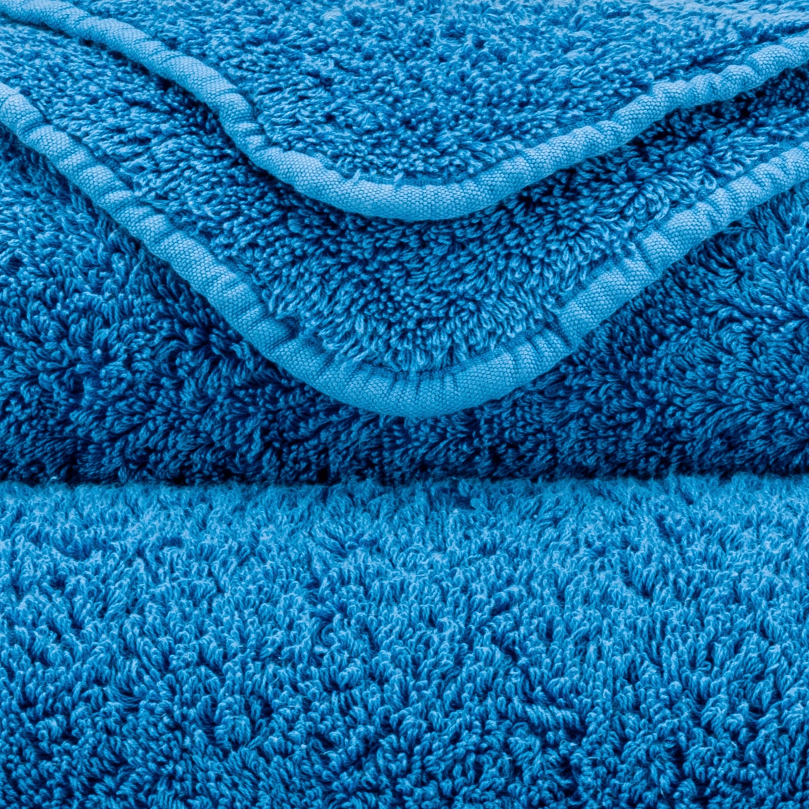 Stack of Abyss Super Pile Bath Towels in Ocean Color