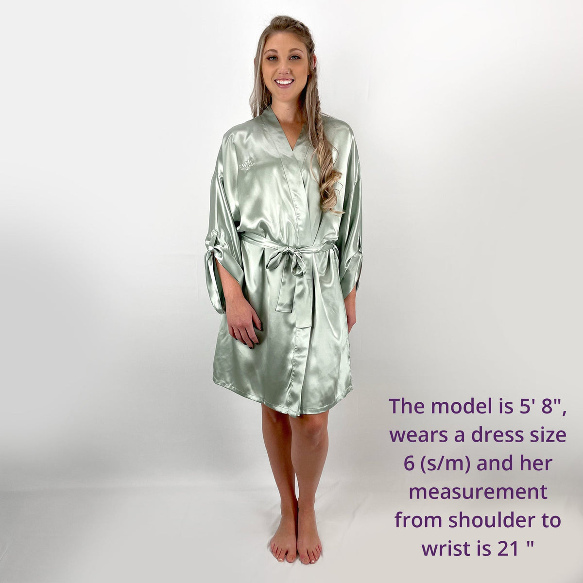 Woman standing in a front view, with measurements and size details of a luxury robes for women