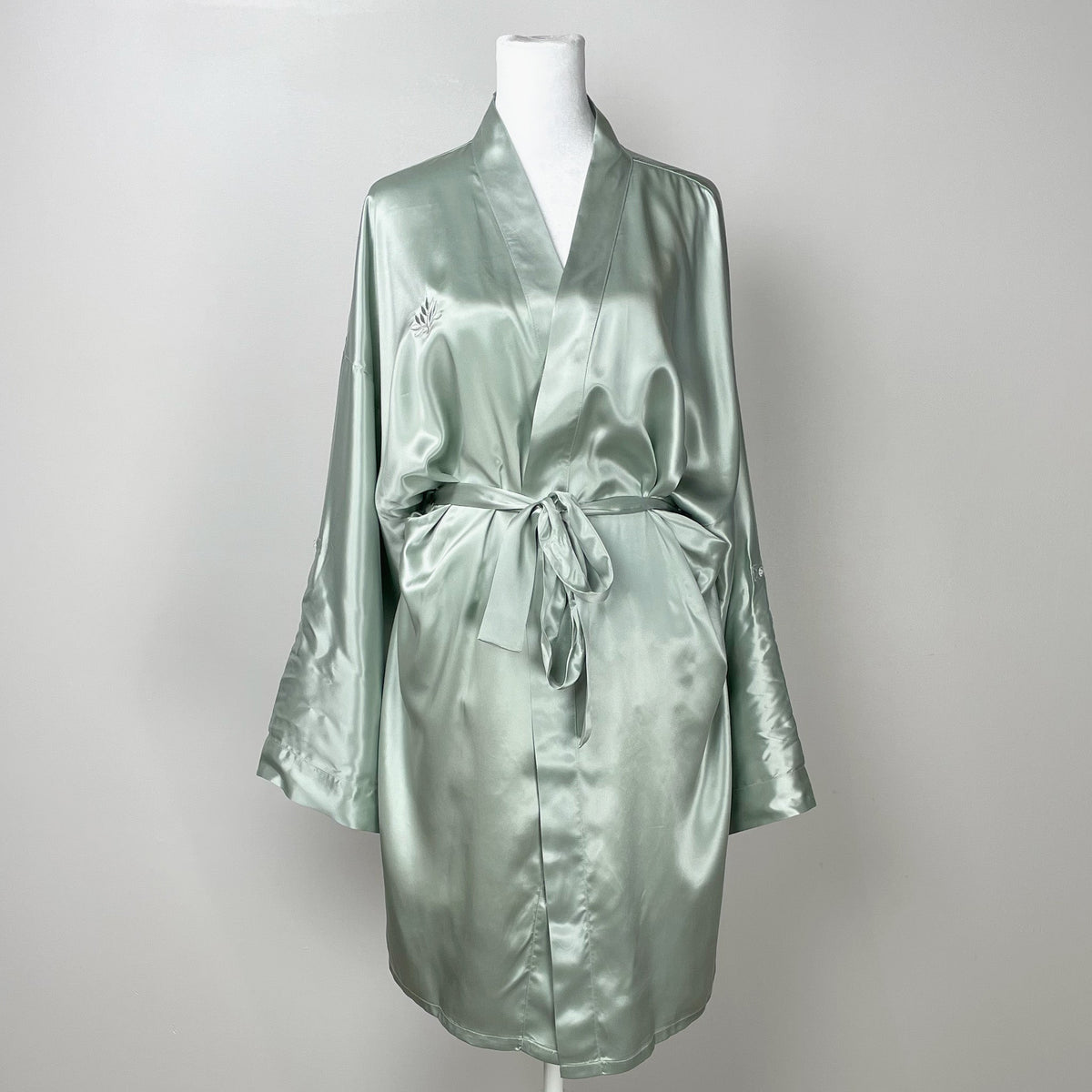 Womens silk kimono robe displayed on a mannequin, showcasing its elegant design and flow
