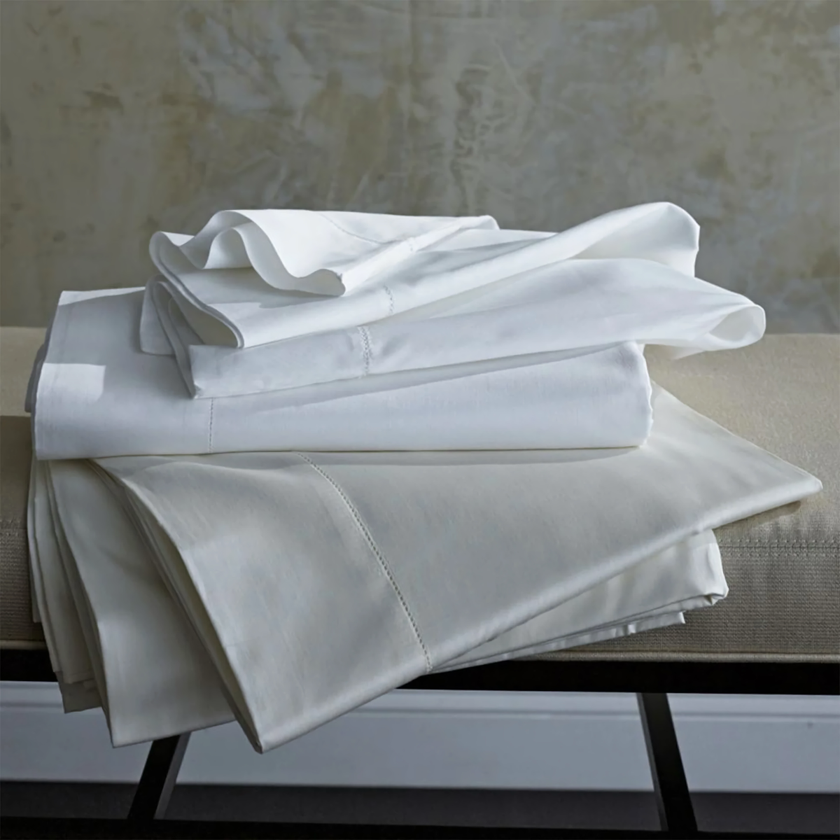 Stack of Folded Scandia Home Classic Natural Lyocell Percale Bedding in both colors