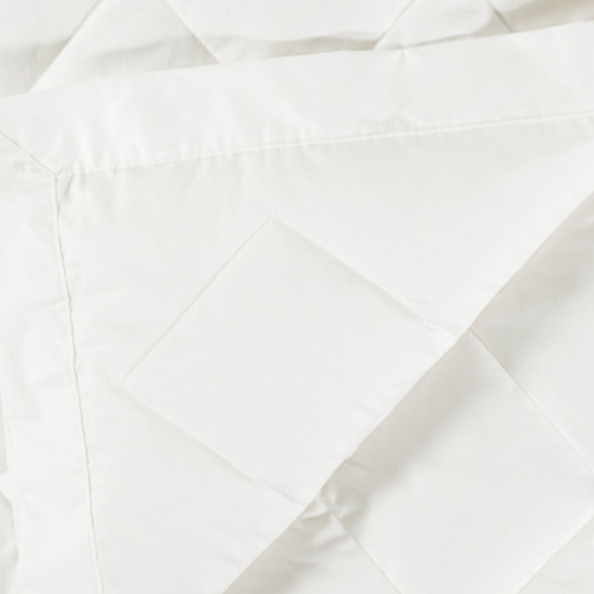 Closeup View of Scandia Home Diamond Quilted Down Blanket in White Color