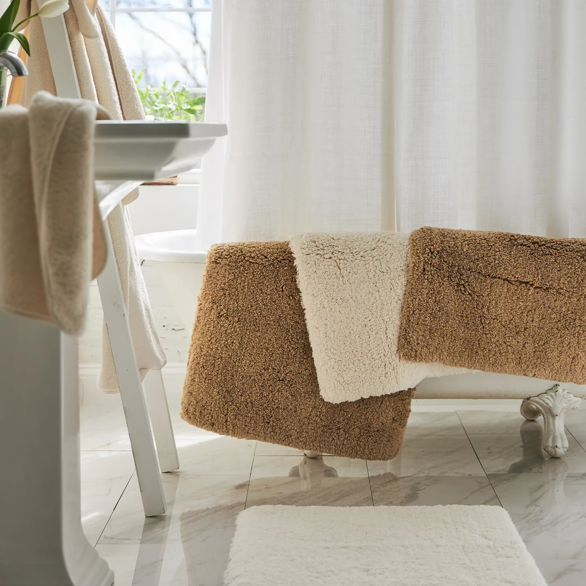 Scandia Home Indulgence Bath Rugs Hanging from Bath Tub