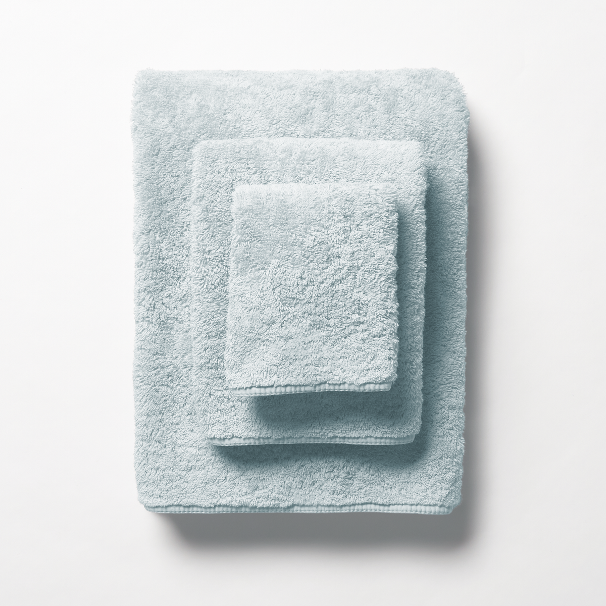 Set of Glacier colored Scandia Home Indulgence Towel on a white background