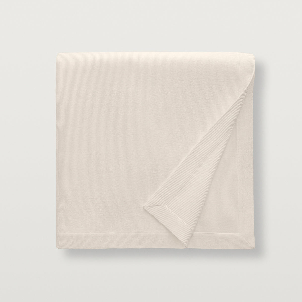 Folded Scandia Home Lorenzo Pique Coverlet in Linen color
