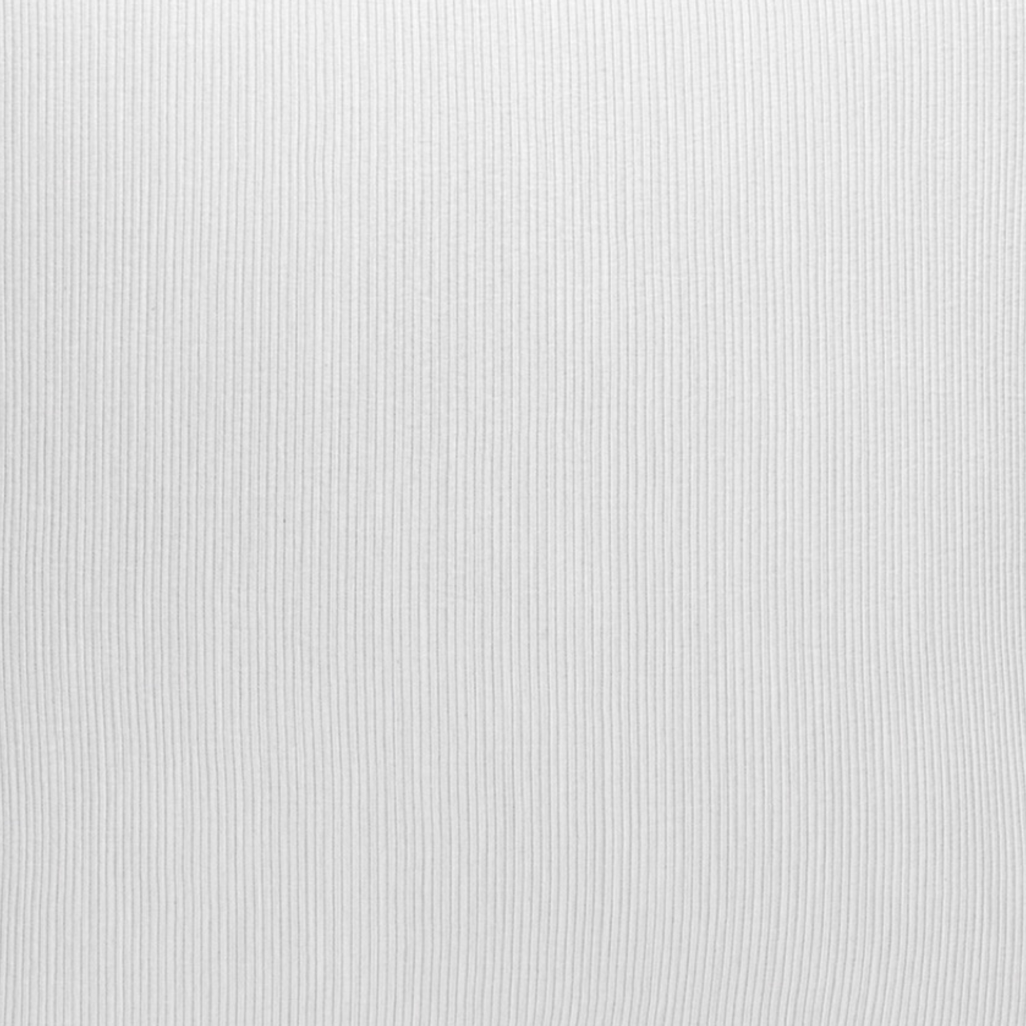 Stack of Scandia Home Lorenzo Pique Shams on a marble surface with a window view of mountains.