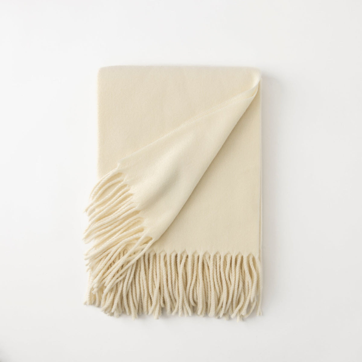 Folded Scandia Home Pietro Throw in Ivory color 