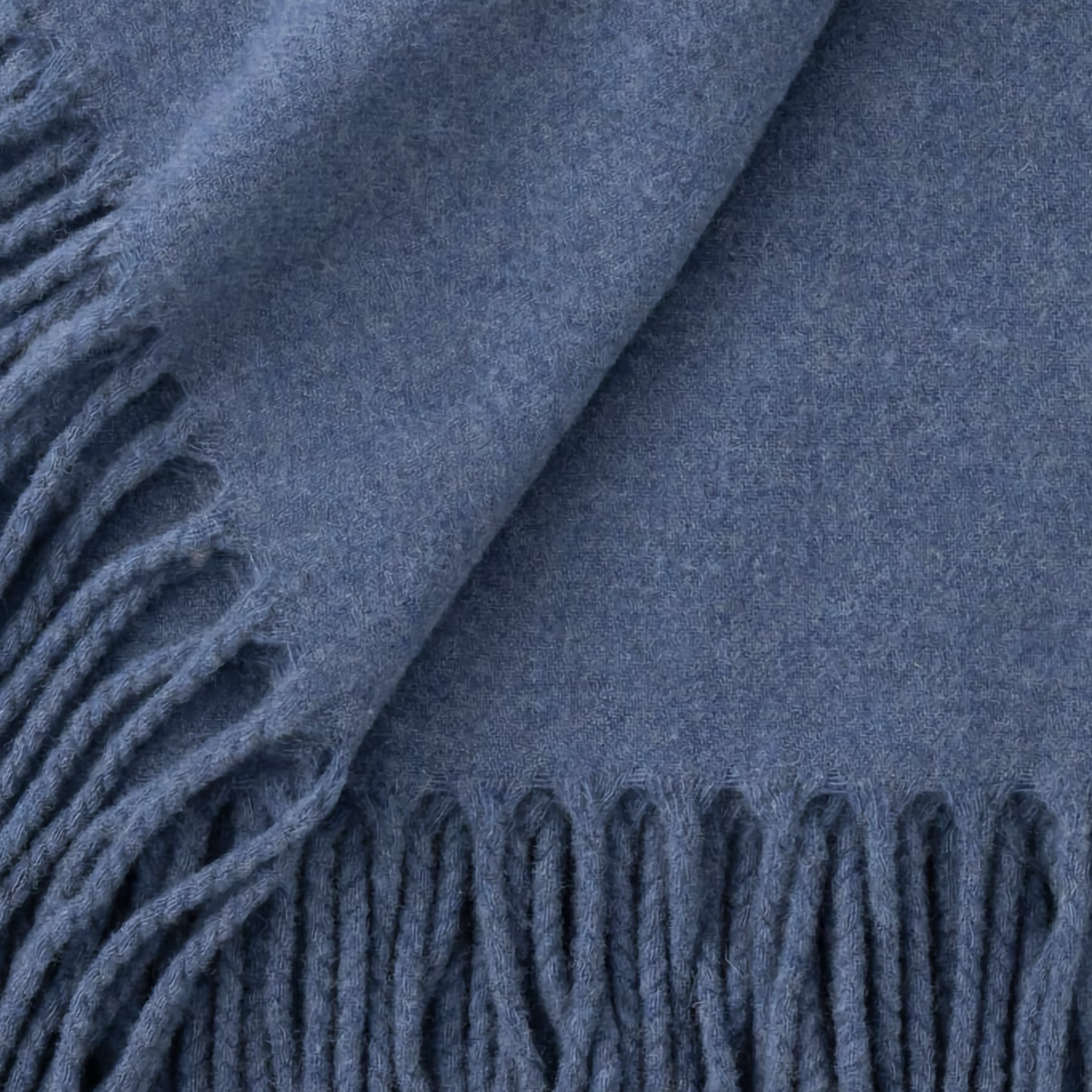 Folded Scandia Home Pietro Throw in Lake Blue color 