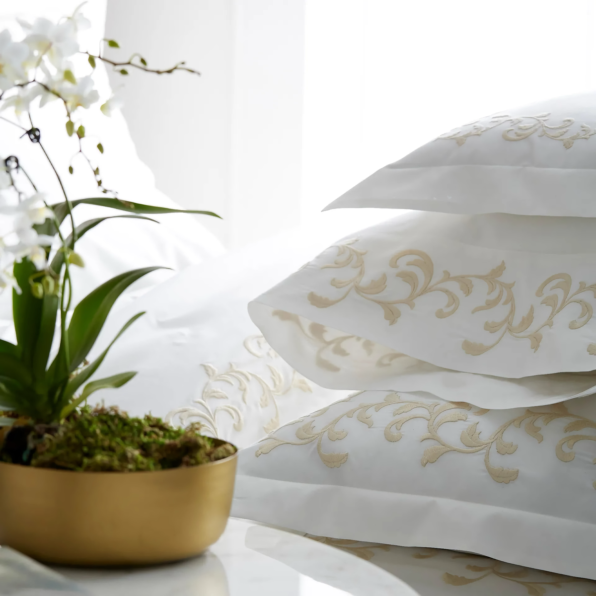 Stack of Cornsilk and Ivory Scandia Home San Remo Bedding Collection