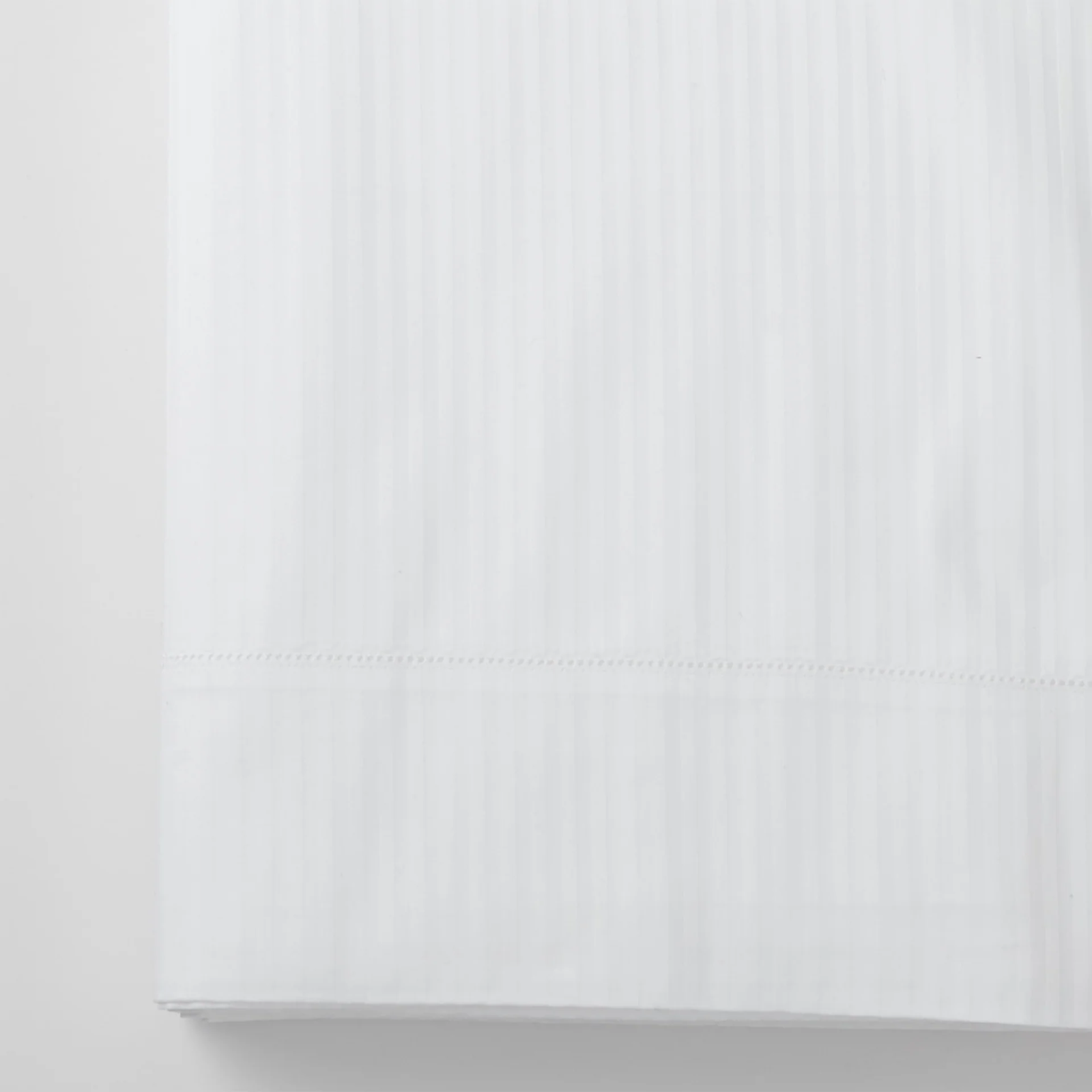 Stack of Folded Scandia Home Savoia Bedding in all colors