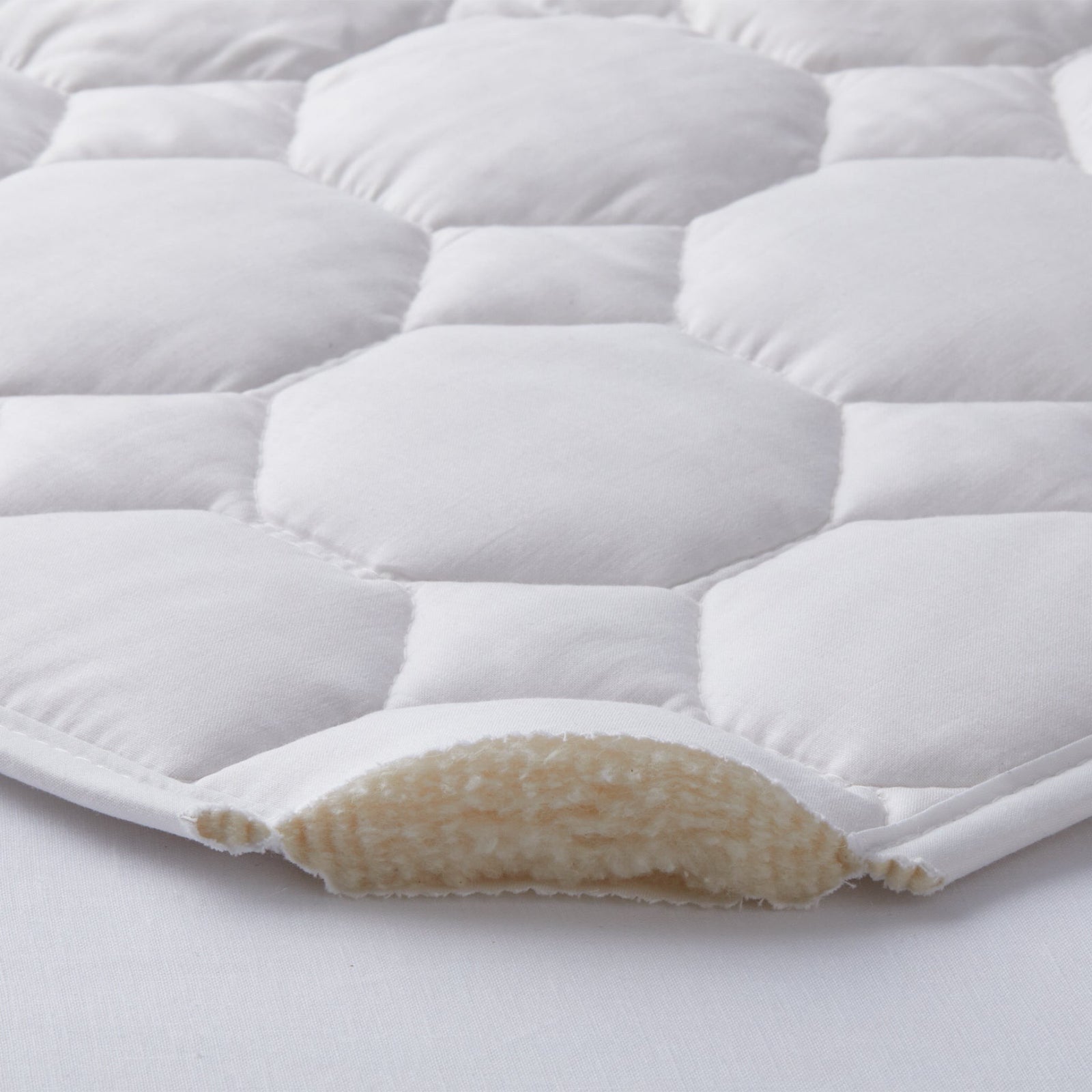 Corner of Mattress with White Scandia Home Sonatina Mattress Pad