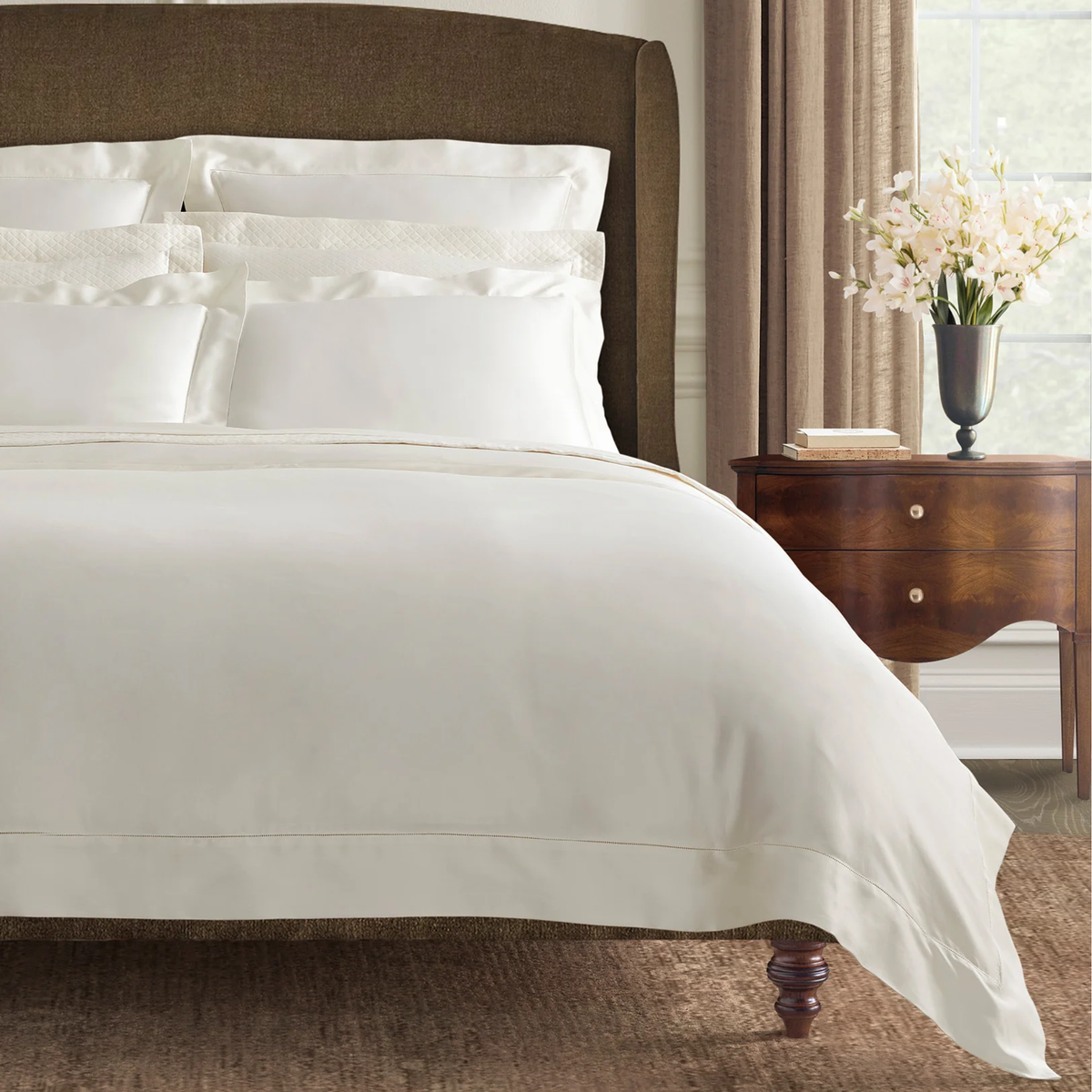 Corner view of Sferra Ariel Bedding in Oyster