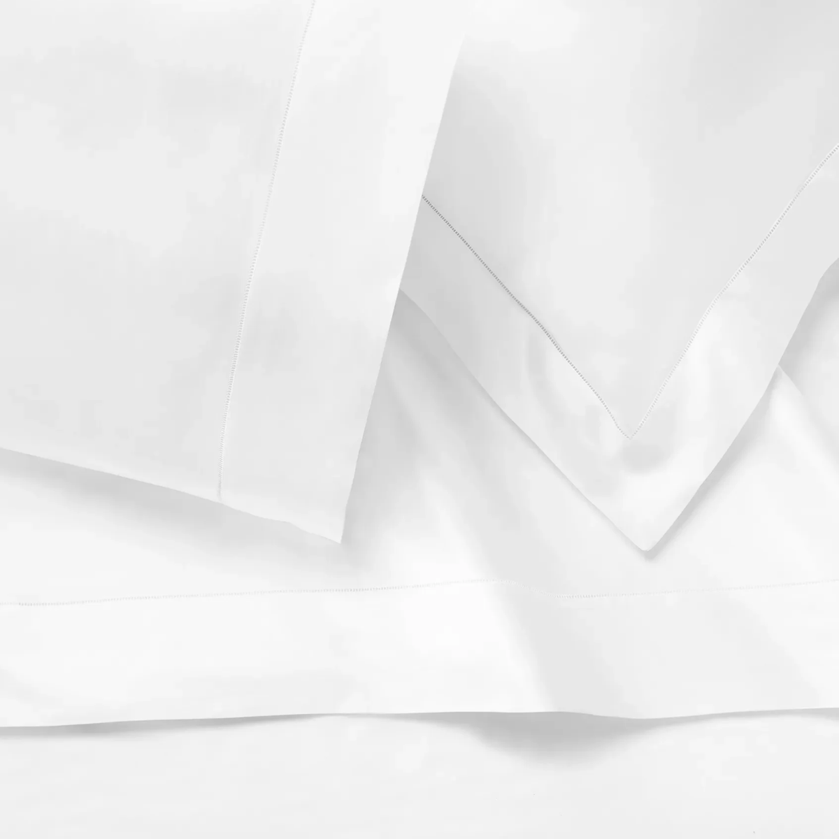 Closeup of Sferra Ariel Bedding in White