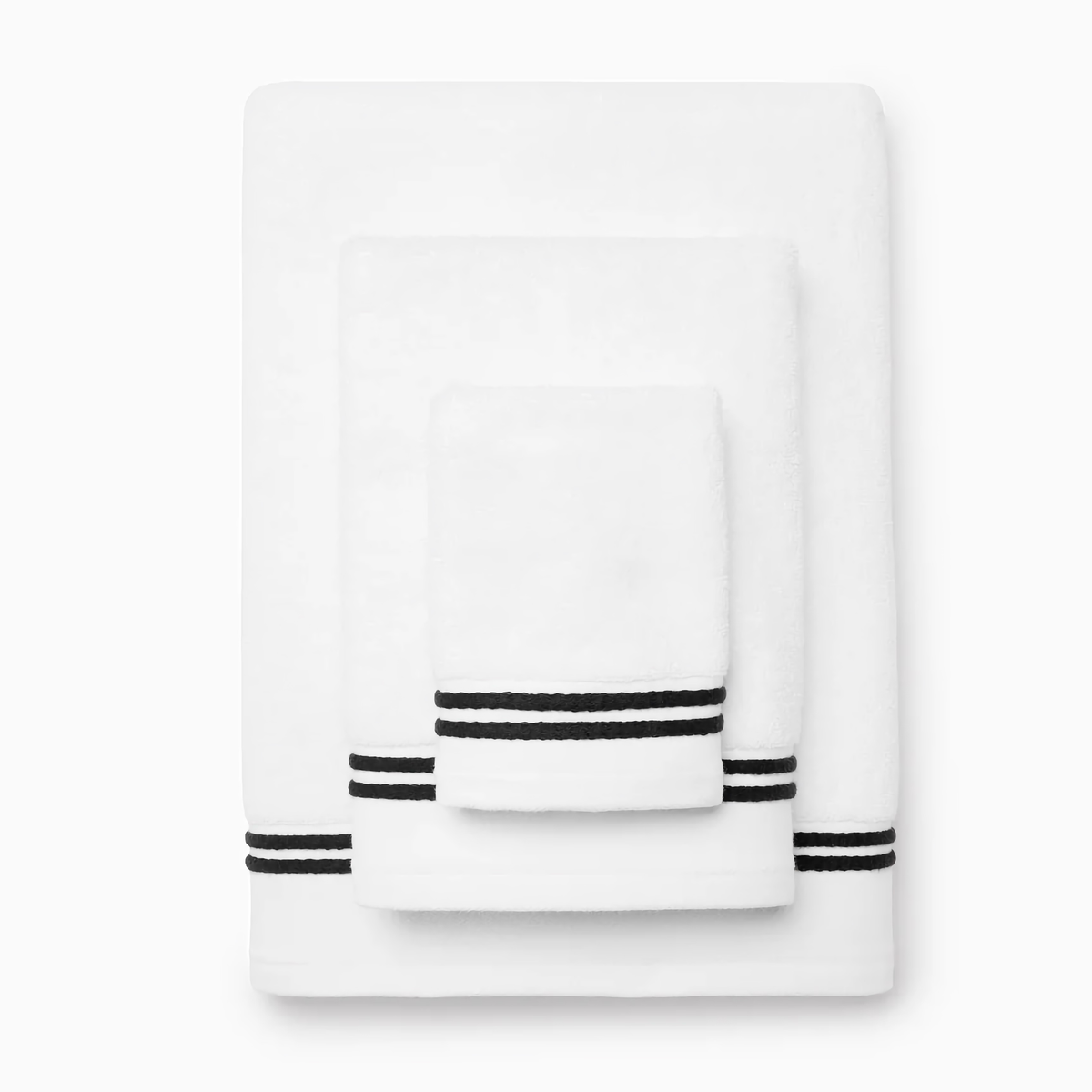 Stack of Sferra Aura Nuova Bath Towels in White and Black