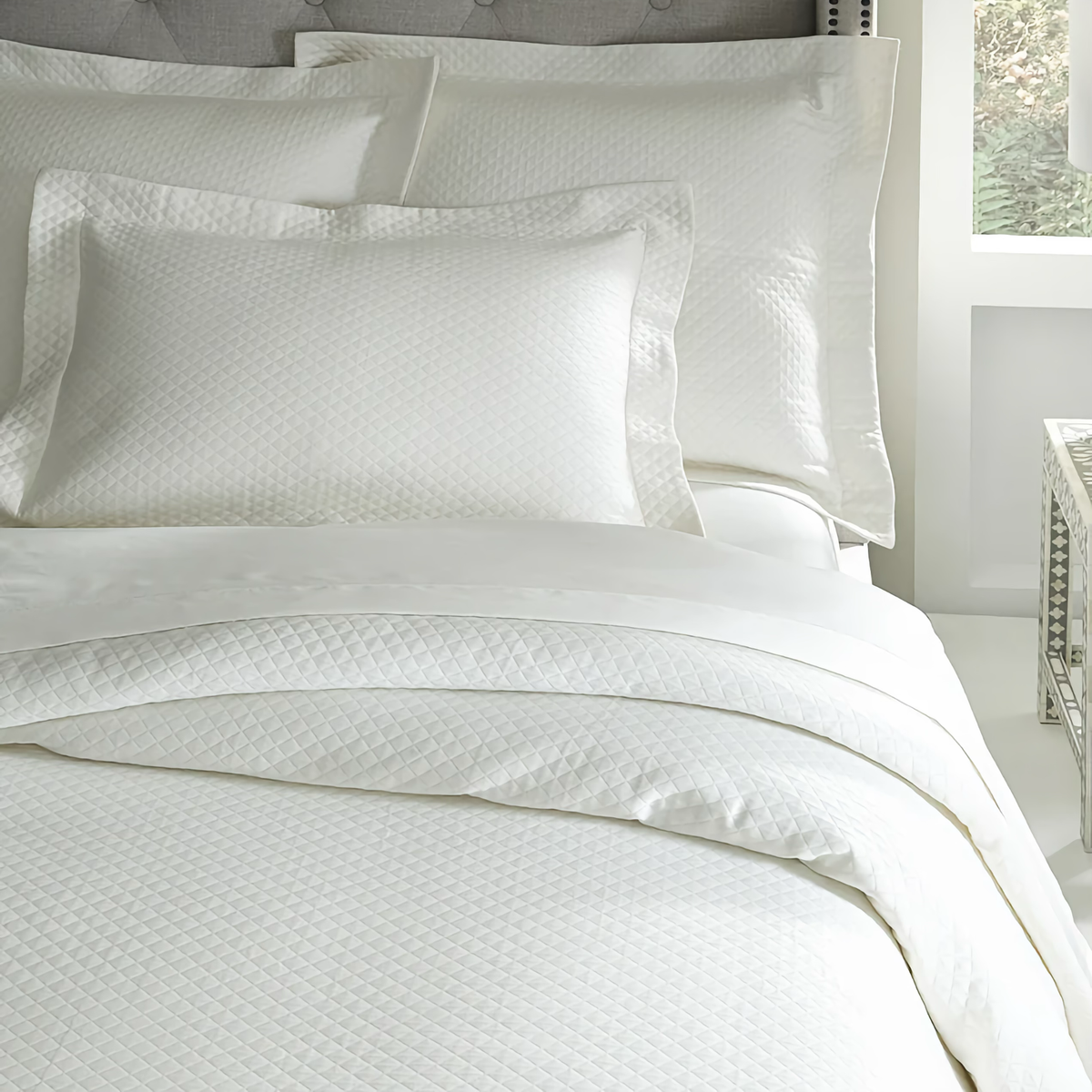 Closeup of Sferra Bari Bedding in Ivory Color