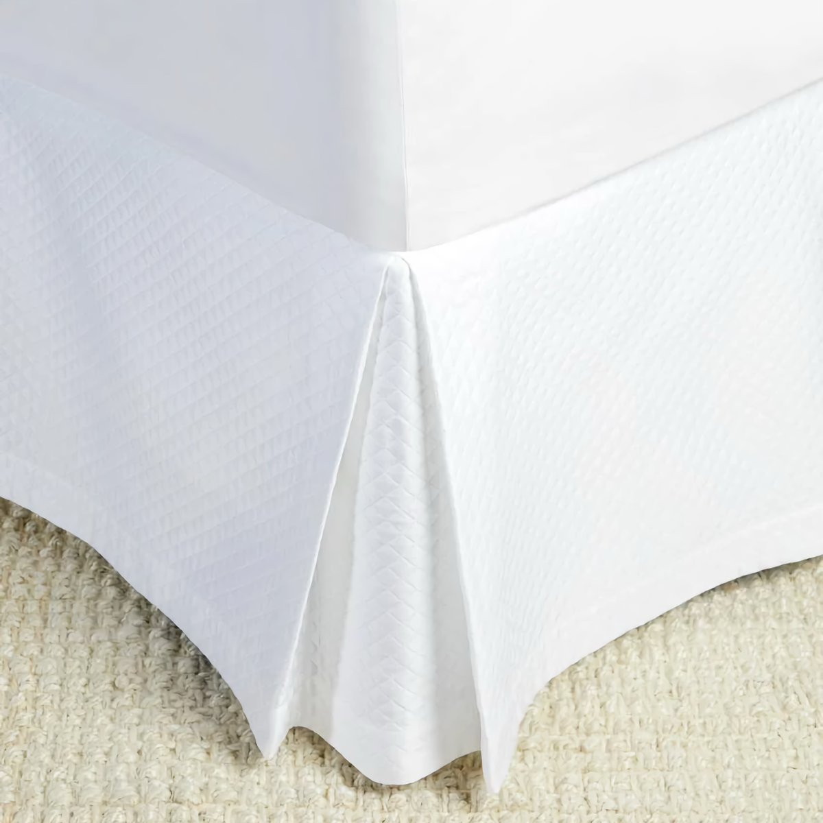 Corner View of Bed Skirt of Sferra Bari Bedding in Color White