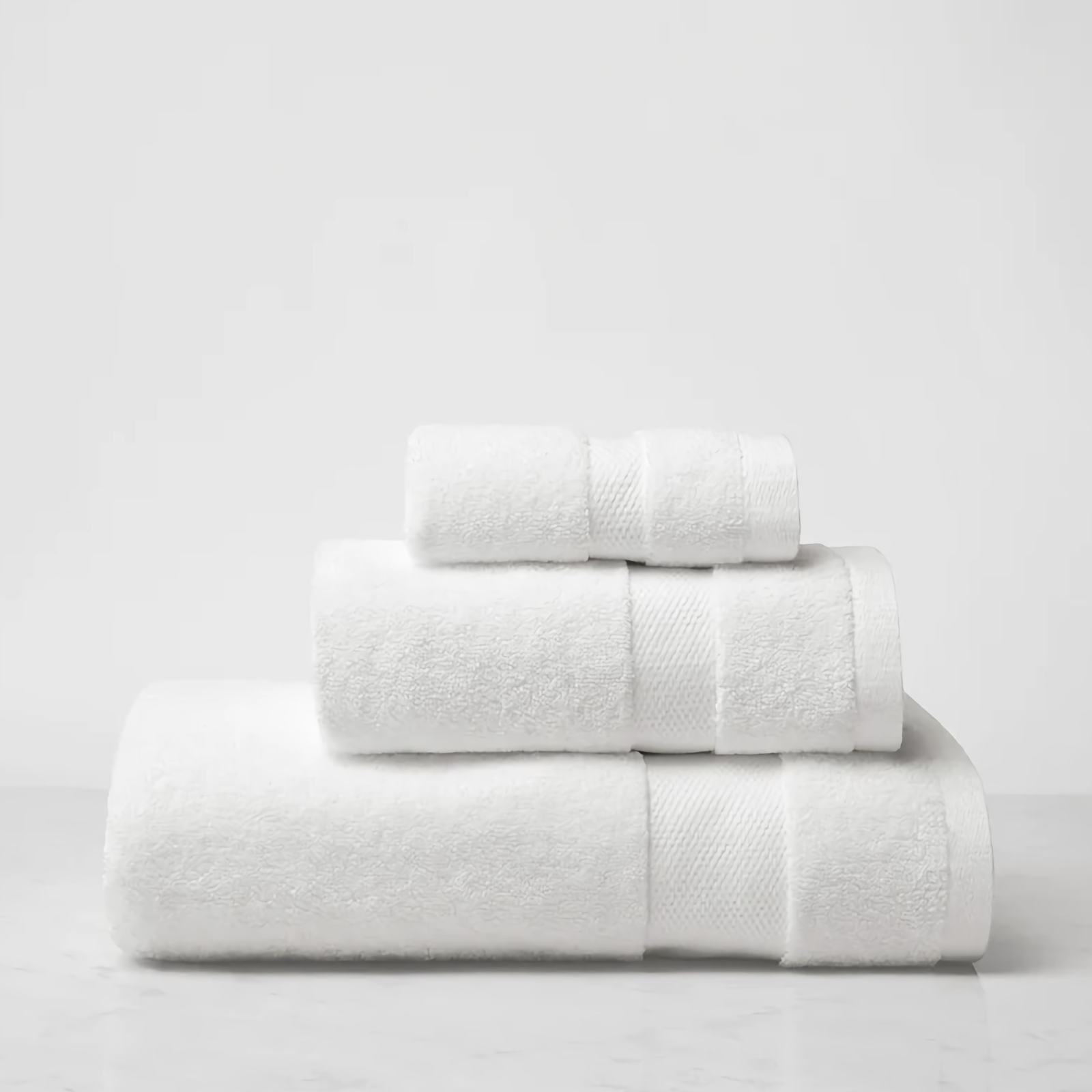 Stack of Sferra Bello Nuovo Bath Towels in White