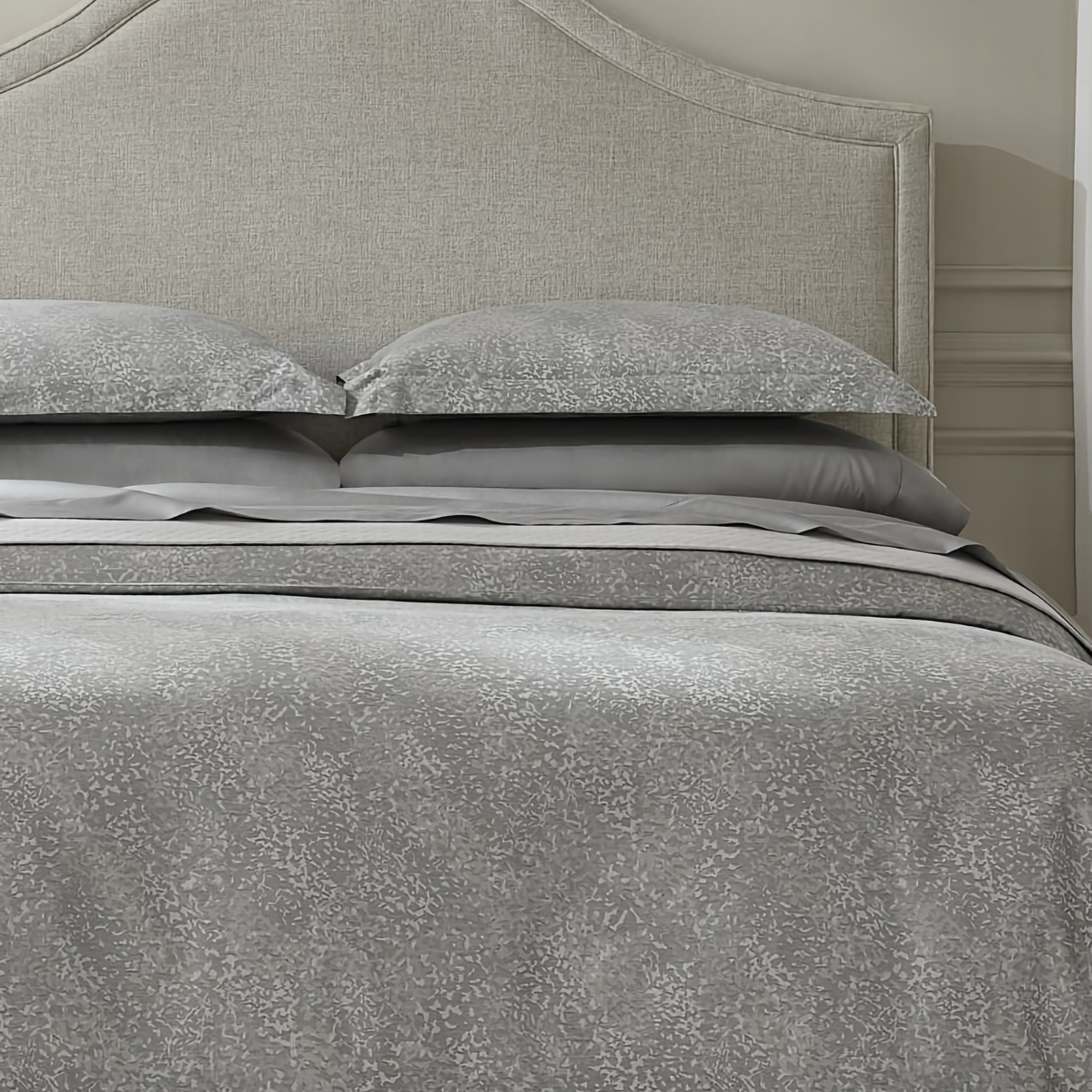 Closeup of Sferra Bione Bedding in Color Slate with Coordinate