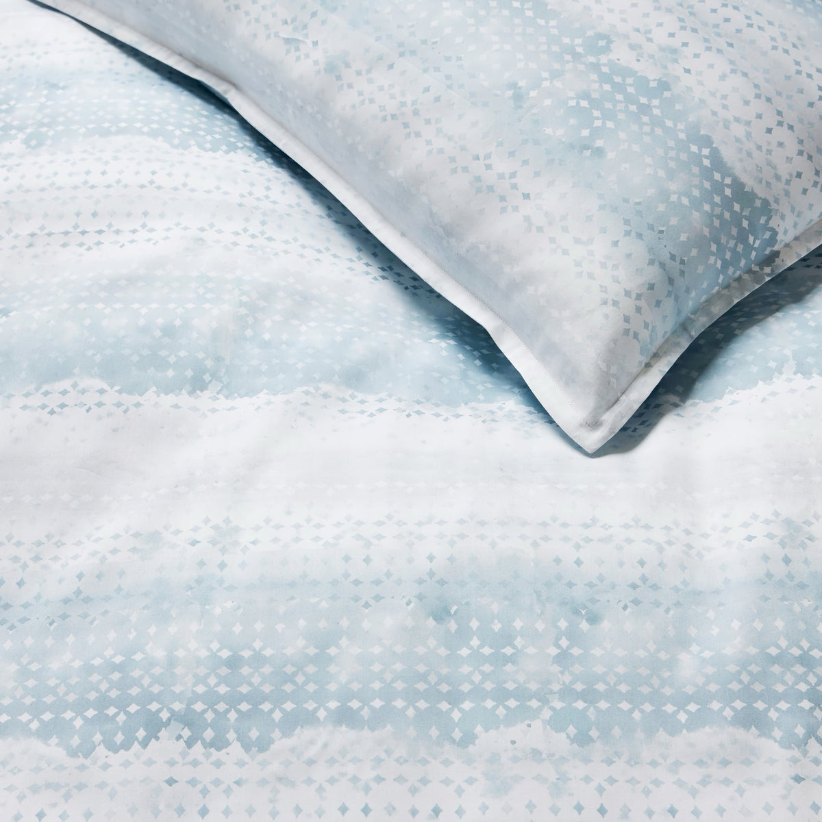 Detailed view of Sferra Brillanti Duvet Cover and Shams in Sky color